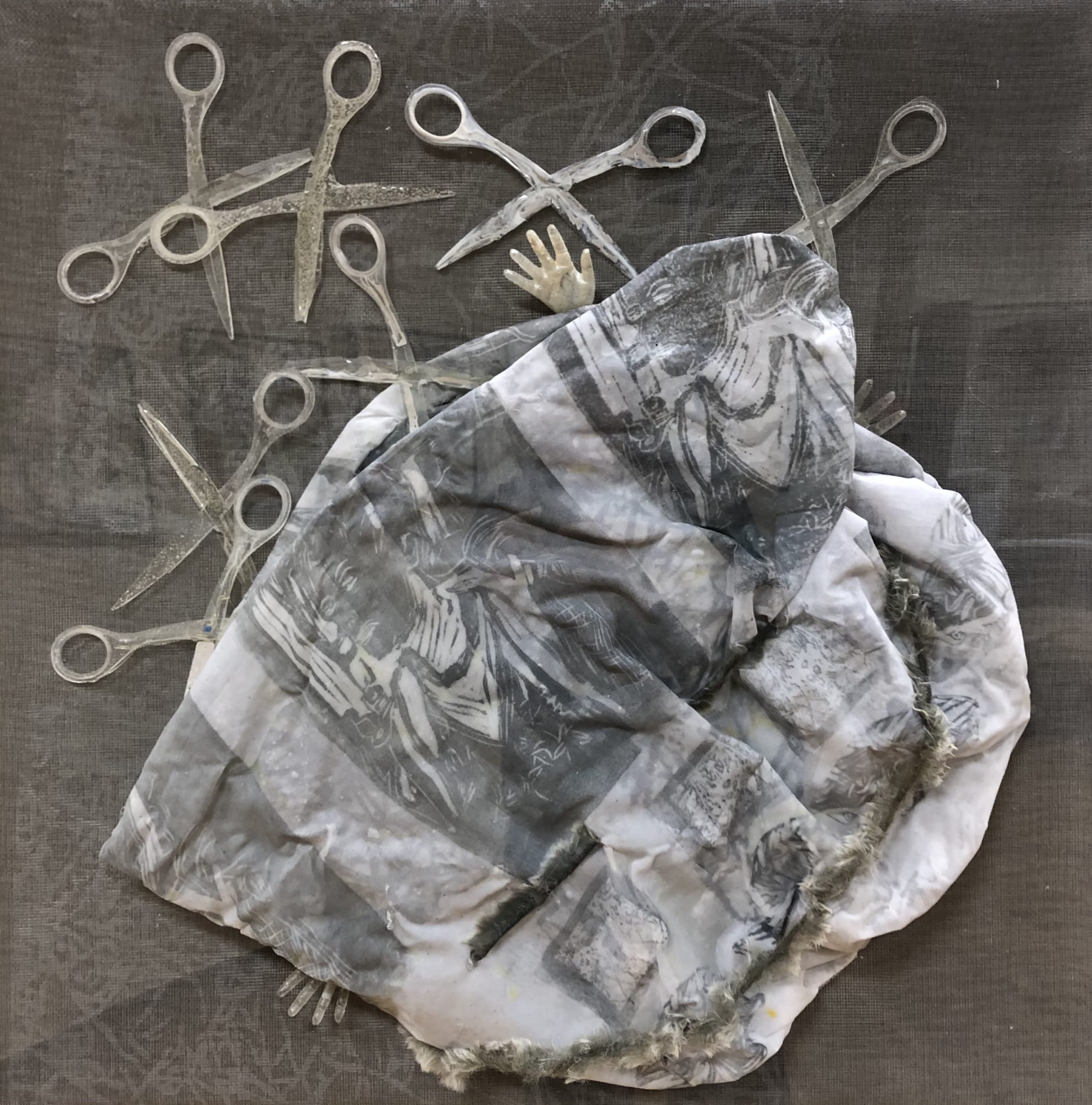 Sally Dion Bag of Disappointments, 2019 Serigraph and Linocut on textile in plexiglass box with resin objects 24 x 24 in. $ 1,400