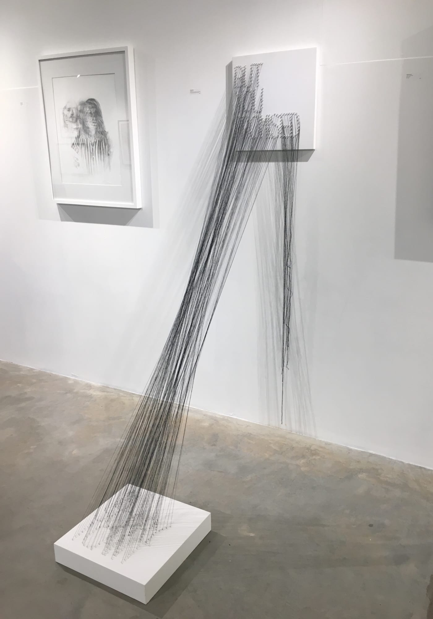Marika Whitaker Tug of War, 2018 Wall, drywall platforms, map pins, and one thread 16 x 16 in. square text plus thread between $900