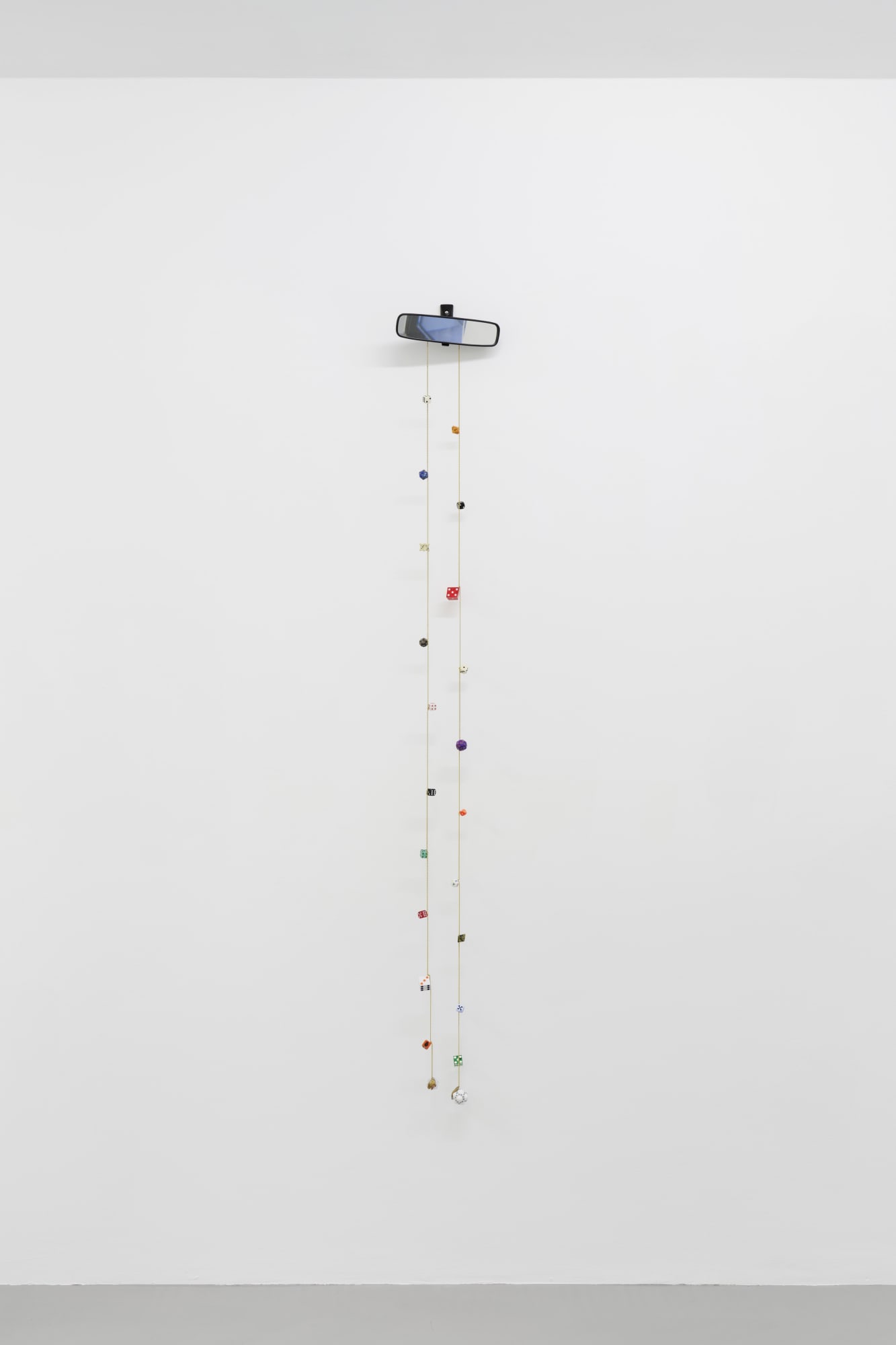 Cassidy Toner, Hindsight is 20/20 #2, 2020-2021, car mirror, dice, brass and chain, 170 x 24 x 6 cm