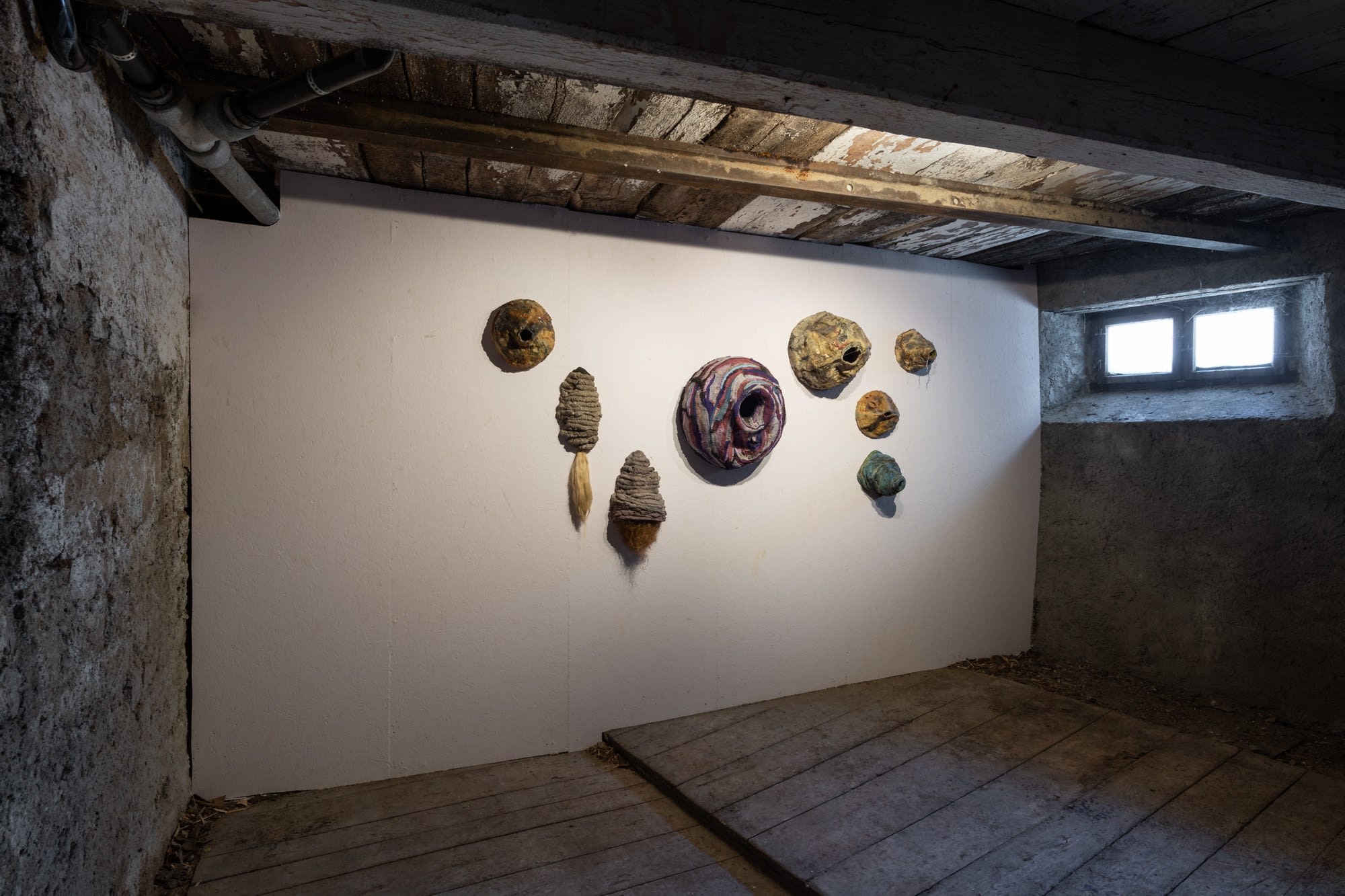 Installation view of eight works, Untitled (Nest), 2017-19, mixed media, dimensions variable