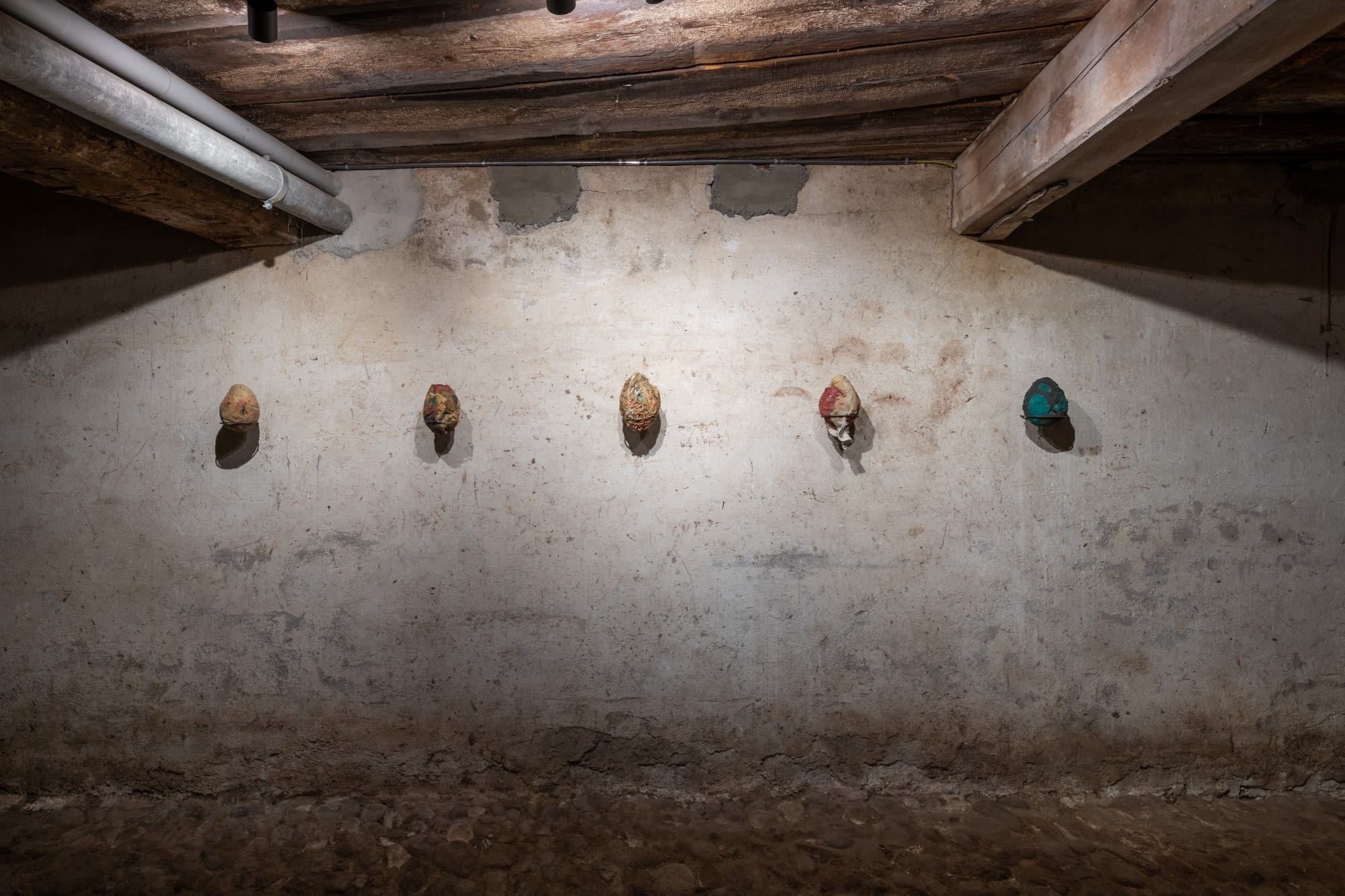 Installation view of five works, Ovo por Olho (An Egg for an Eye), 2017, latex, fabric, organic material, dimensions variable