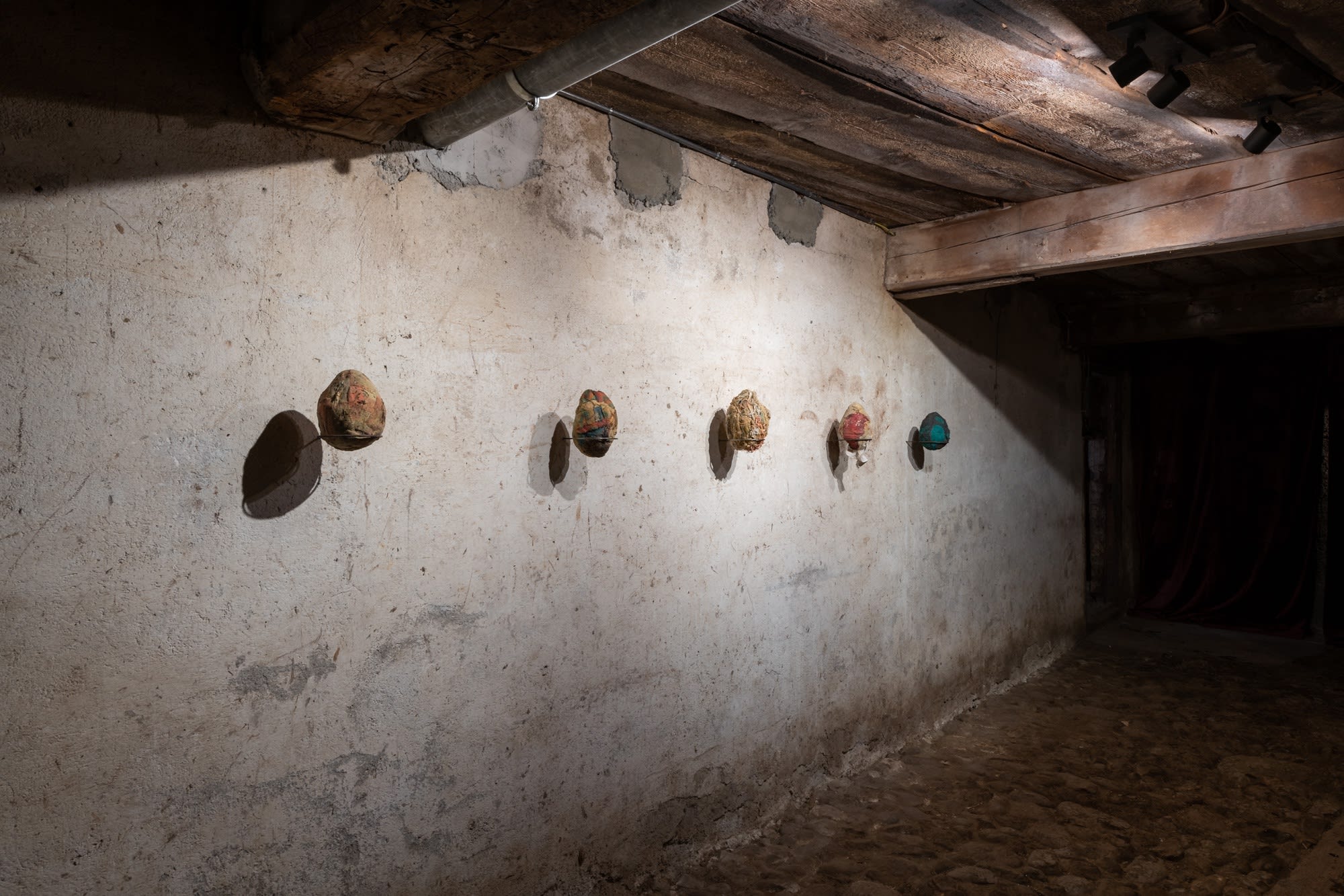 Installation view of five works, Ovo por Olho (An Egg for an Eye), 2017, latex, fabric, organic material, dimensions variable