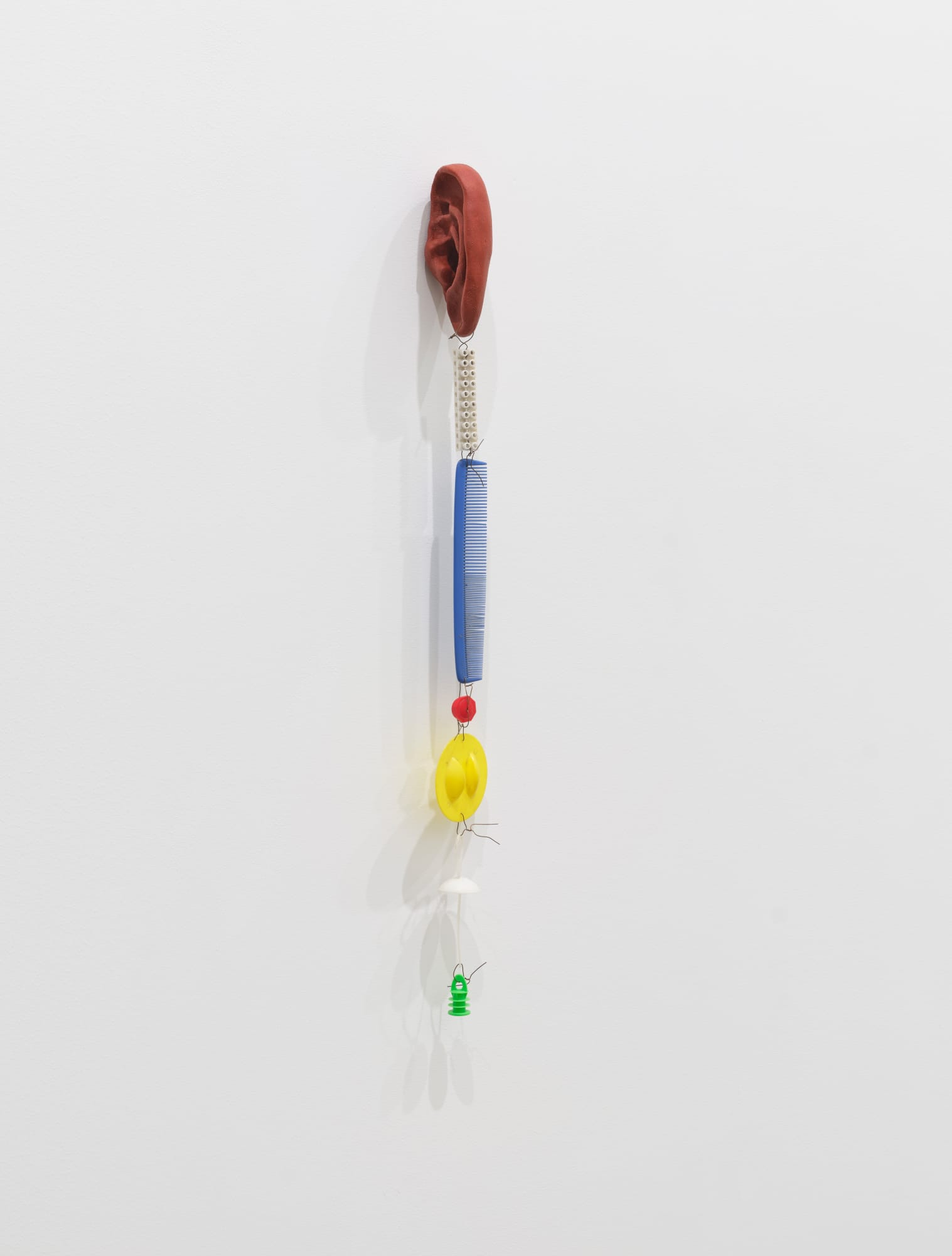 Metaphytosis (Bernhard #1), 2024, burned clay, old plastic objects, wire, 66.5 x 4 x 6.5 cm Collaboration between Pedro Wirz & Bernhard Schobinger
