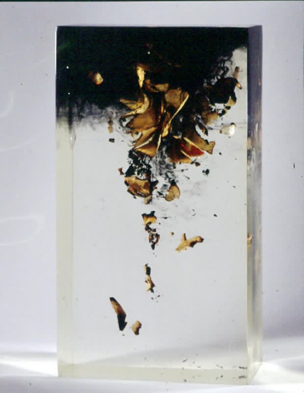 Burnt paper within an acrylic block