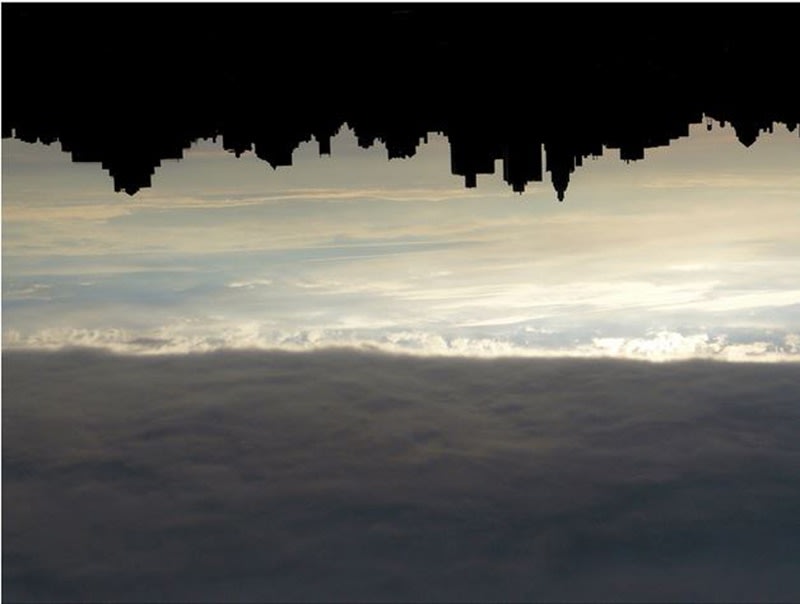Photograph of the New York skyline in silhouette turned up-side down