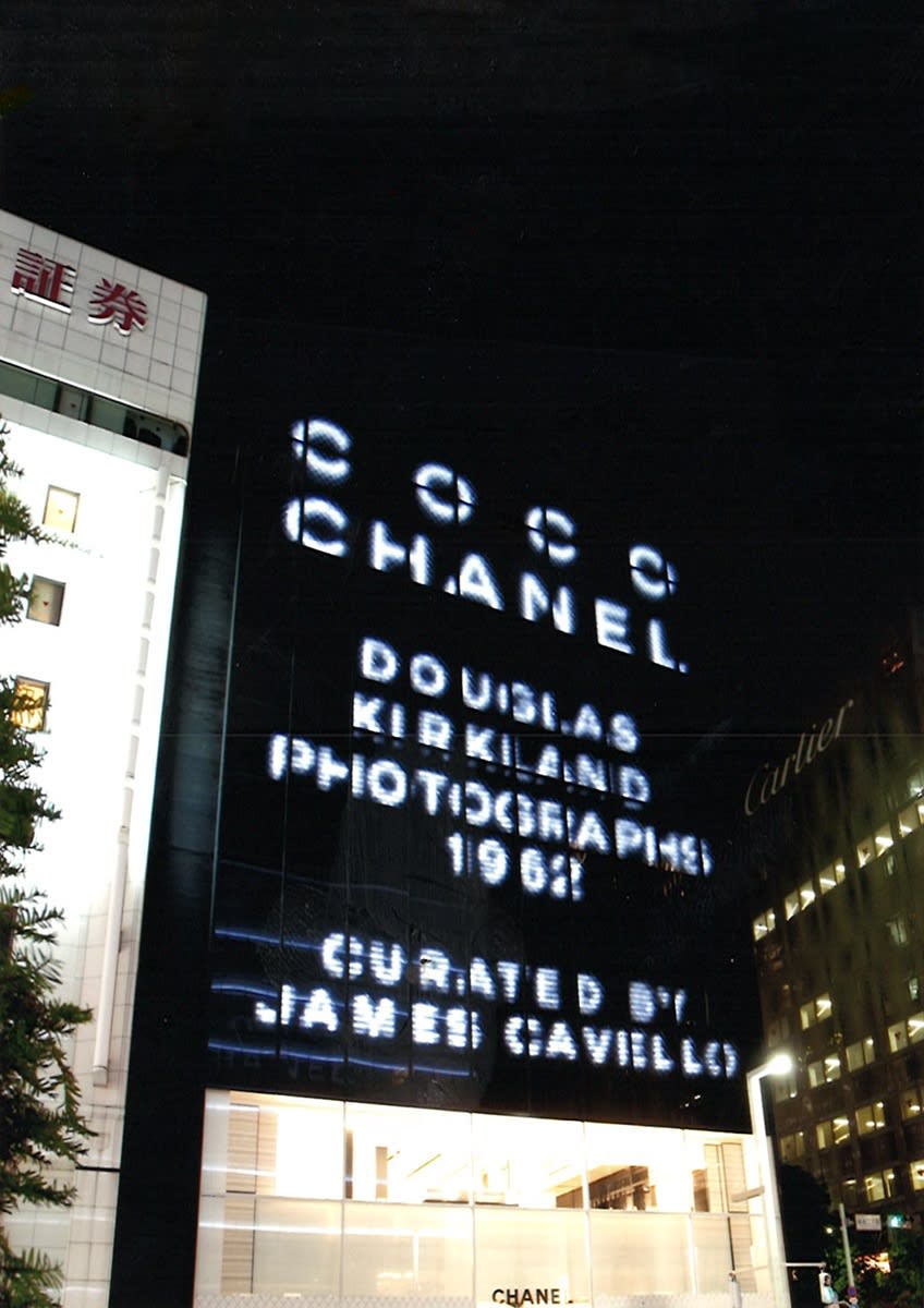 Exterior view of Chanel in Ginza, Tokyo displaying a sign for its exhibition of photographs of Coco Chanel taken by Douglas Kirkland in 1962