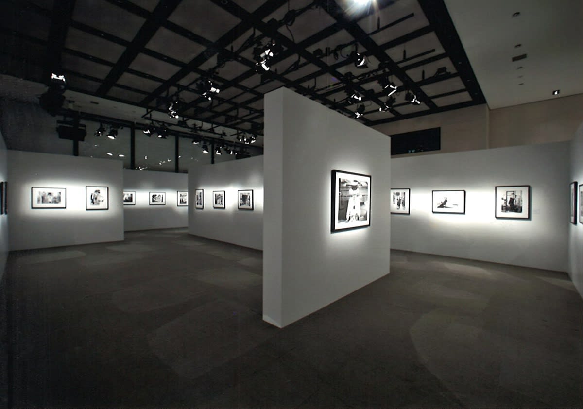 Installation view of the exhibition Coco Chanel, 1962: Photographs by Douglas Kirkland featuring several black and white photographs of Coco Chanel in Ginza, Tokyo 