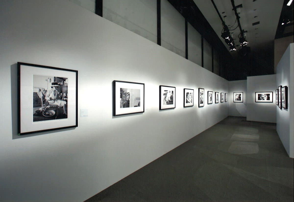 Installation view of the exhibition Coco Chanel, 1962: Photographs by Douglas Kirkland featuring several black and white photographs of Coco Chanel in Ginza, Tokyo