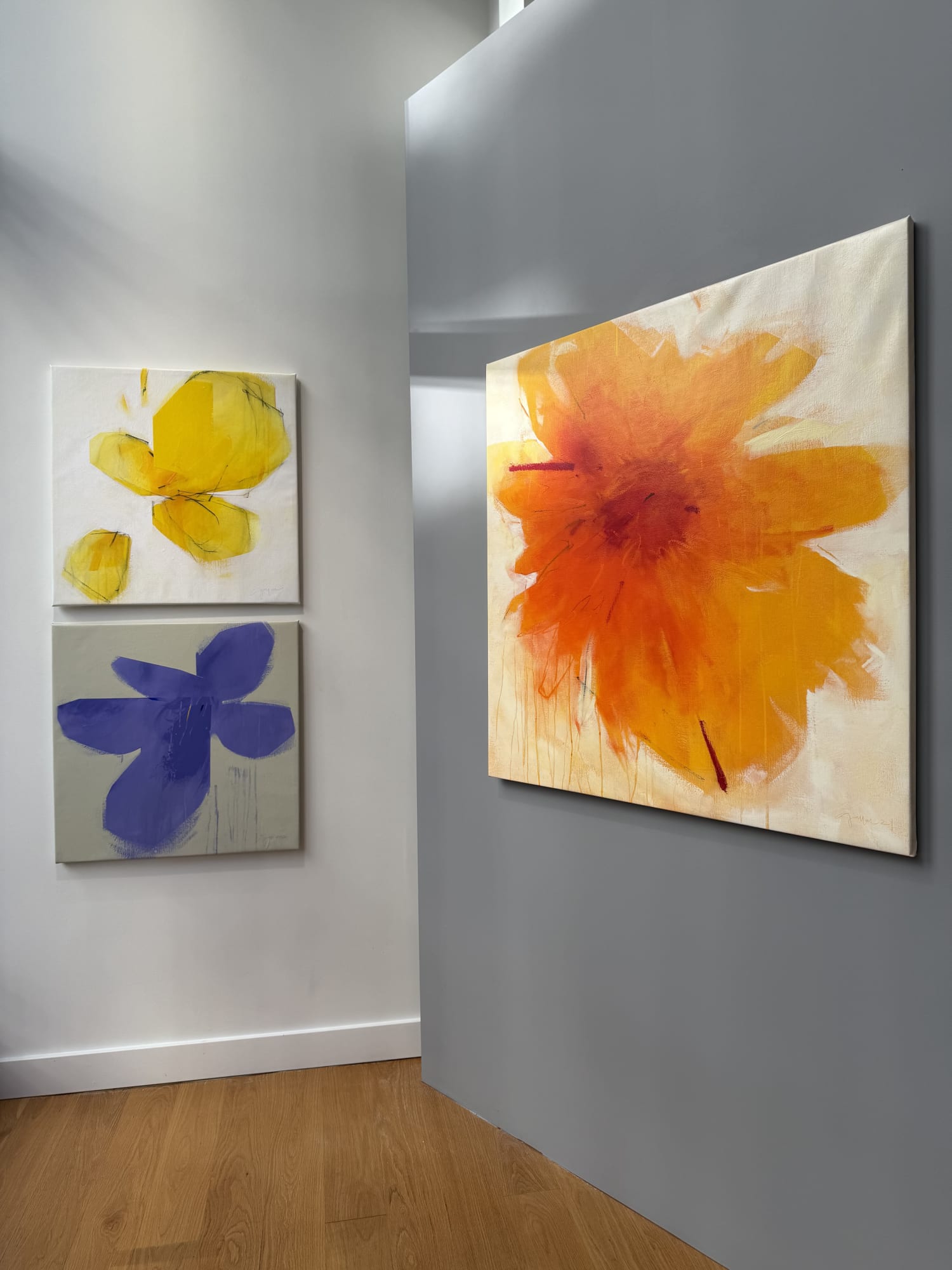 paintings of flowers in a gallery