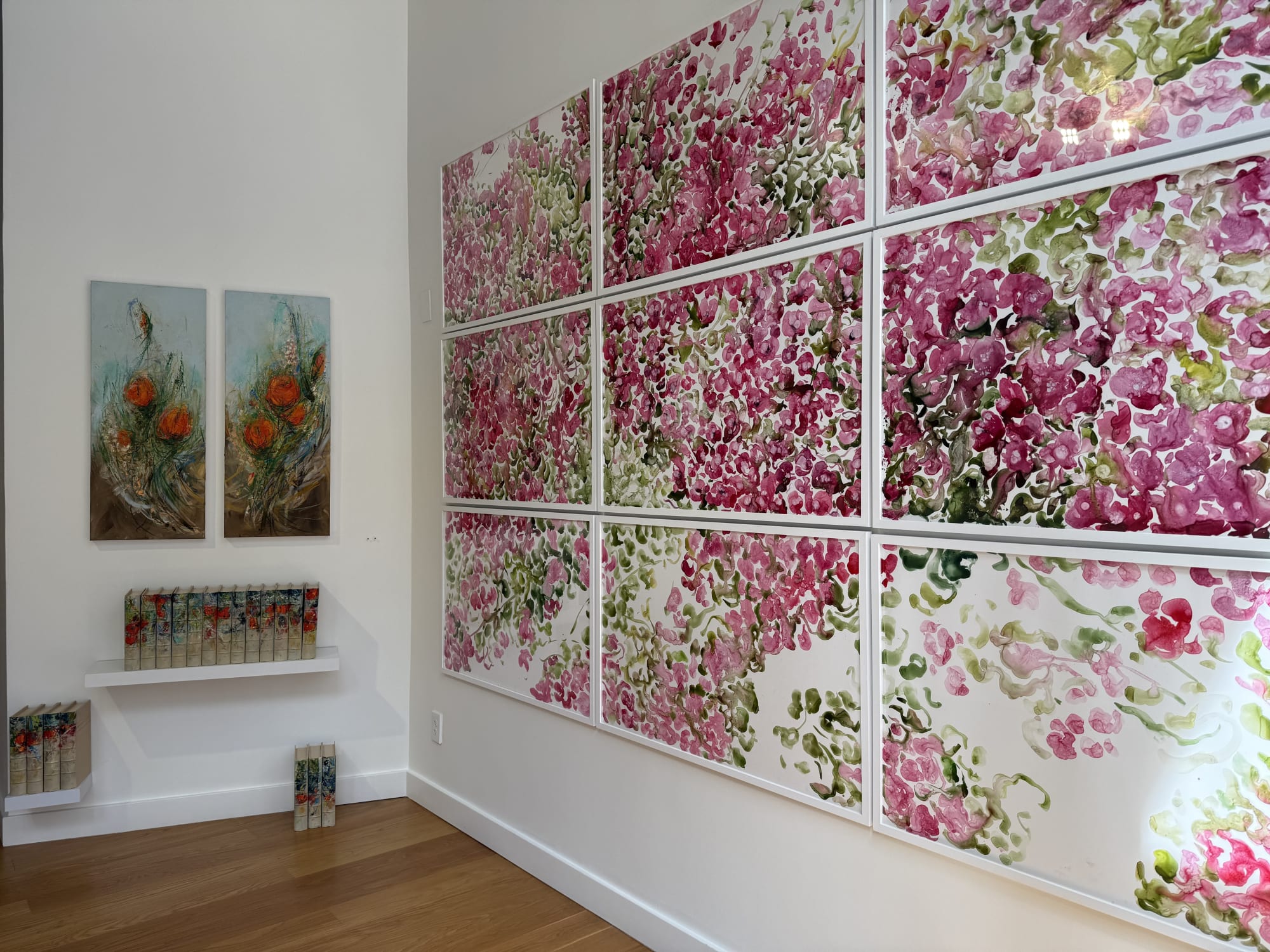 paintings of flowers in a gallery