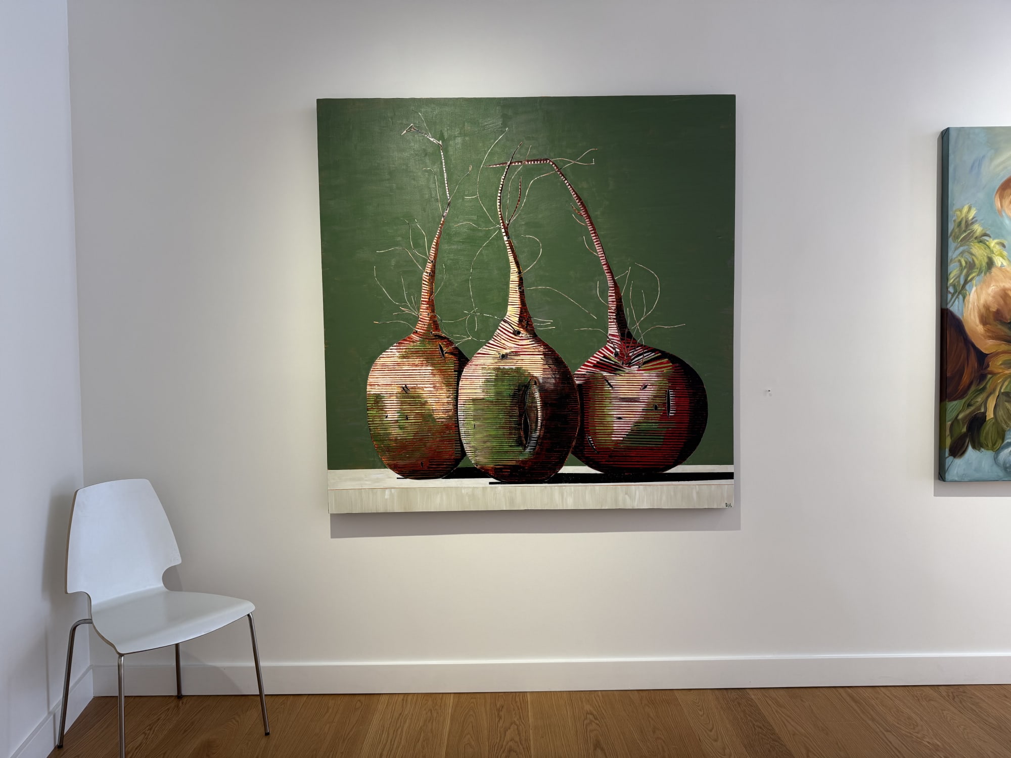 paintings of flowers in a gallery