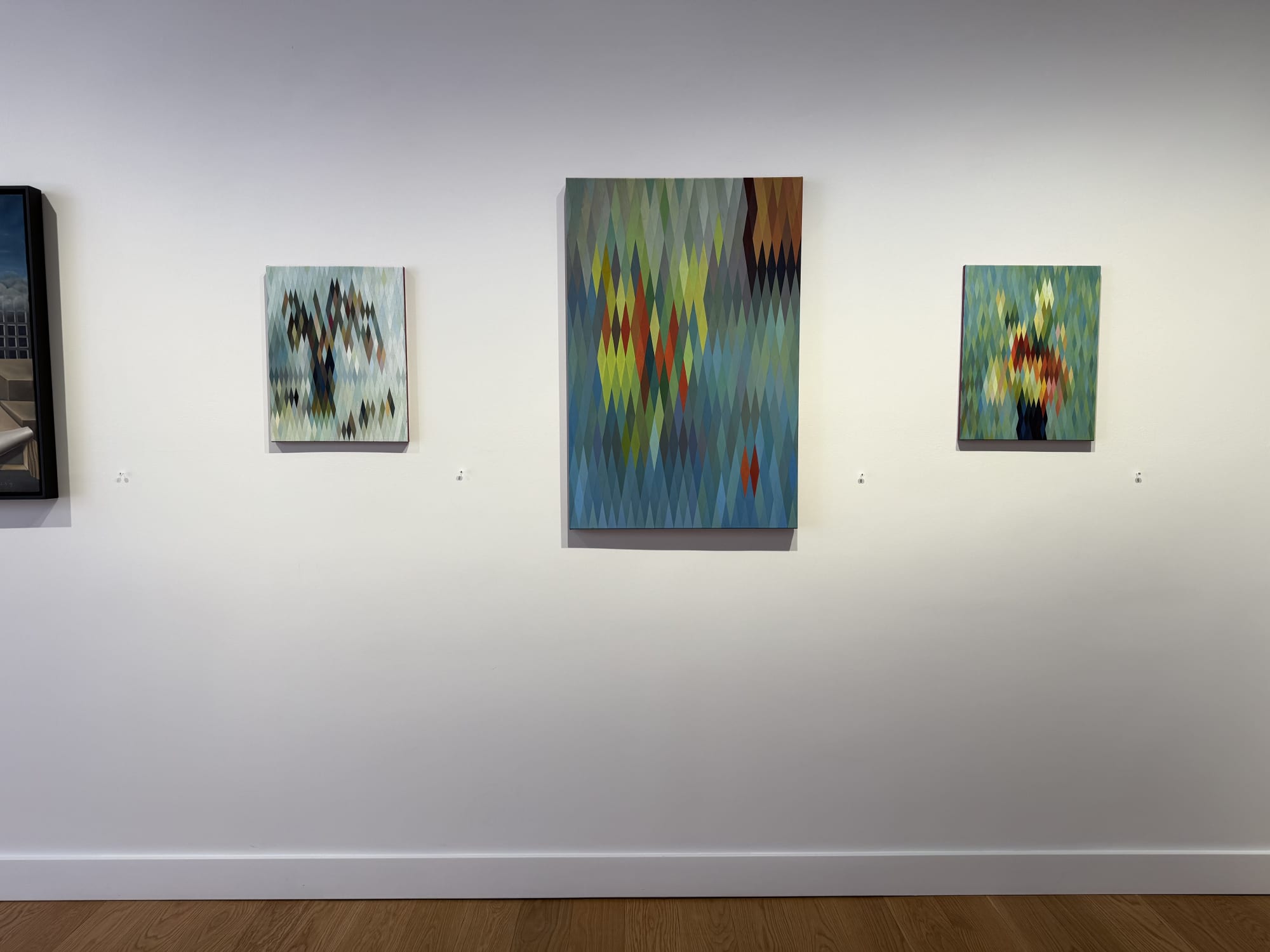 paintings of flowers in a gallery