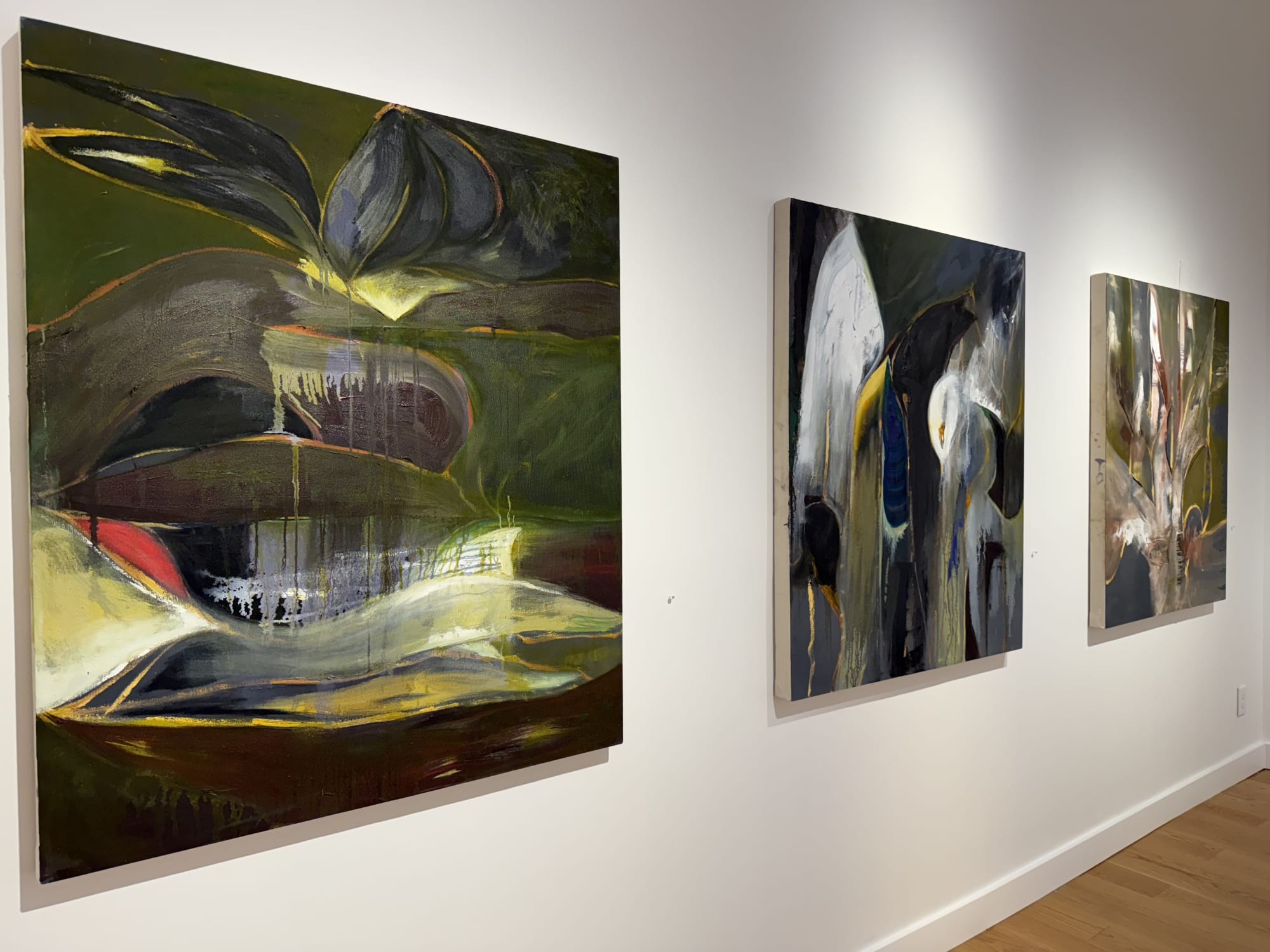 paintings of flowers in a gallery