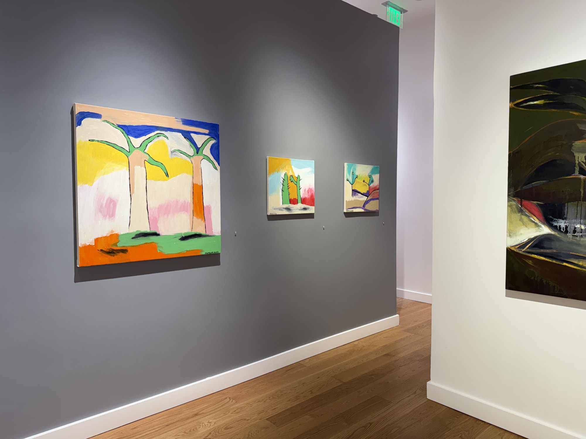 paintings of flowers in a gallery
