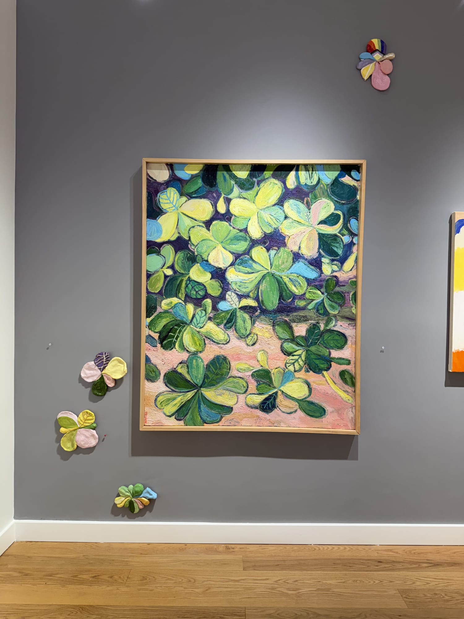 paintings of flowers in a gallery