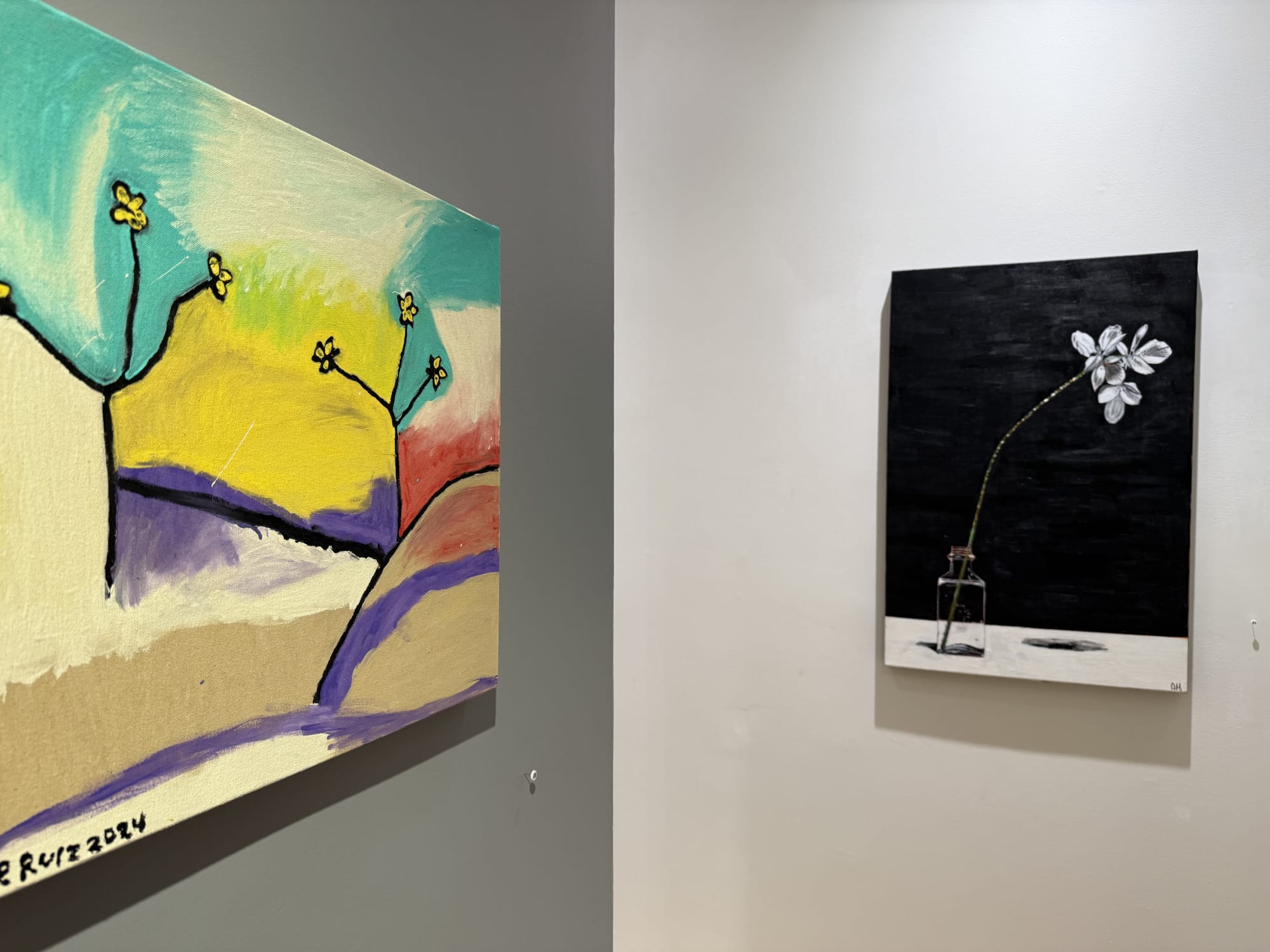 paintings of flowers in a gallery