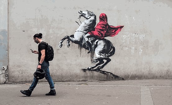 Banksy’s 2018 Liberte Egalite Cable TV mural satirises modern life using French revolutionary style.