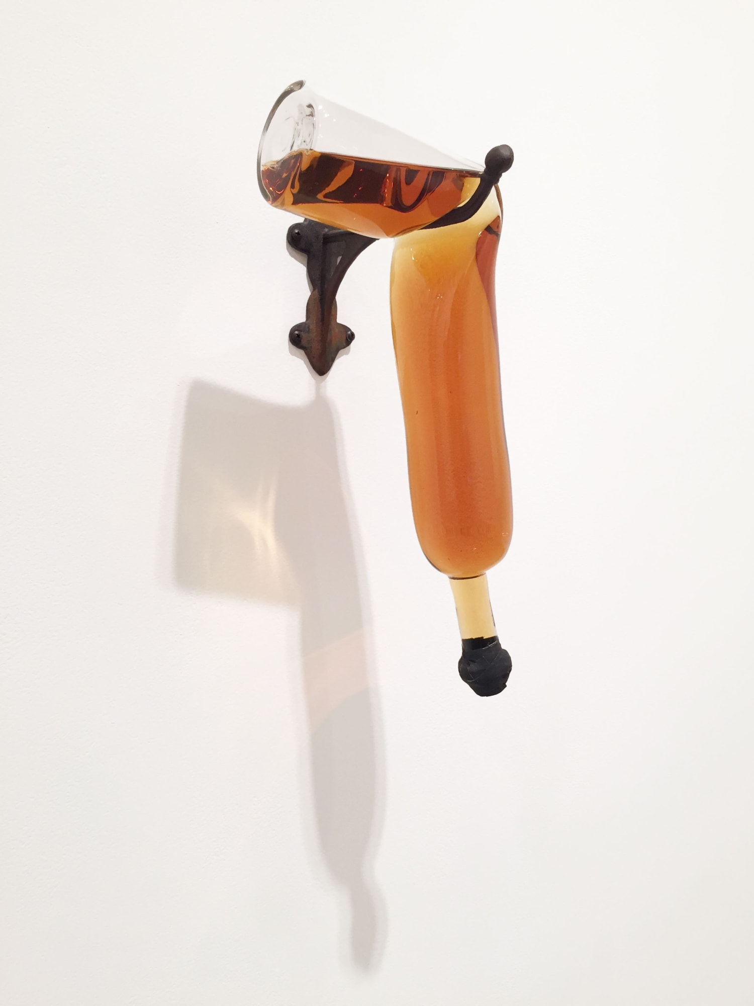 Donald Lipski Whiskey River No. 32, 2014 - 2015 Hand blown glass, Scotch whiskey, iron, rubber, tape 18 x 8 x 9 inches