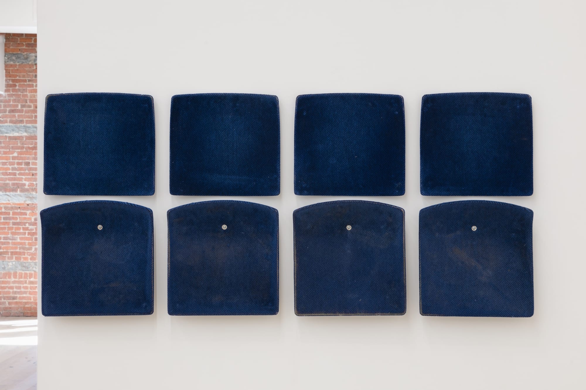 Jessica Vaughn After Willis (rubbed, used and moved) #008, 2017 7 individual pairs of used machine fabricated public transit train seats (Chicago Transit Authority 1998 - 2011) 32 x 284 x 2 3/4 inches