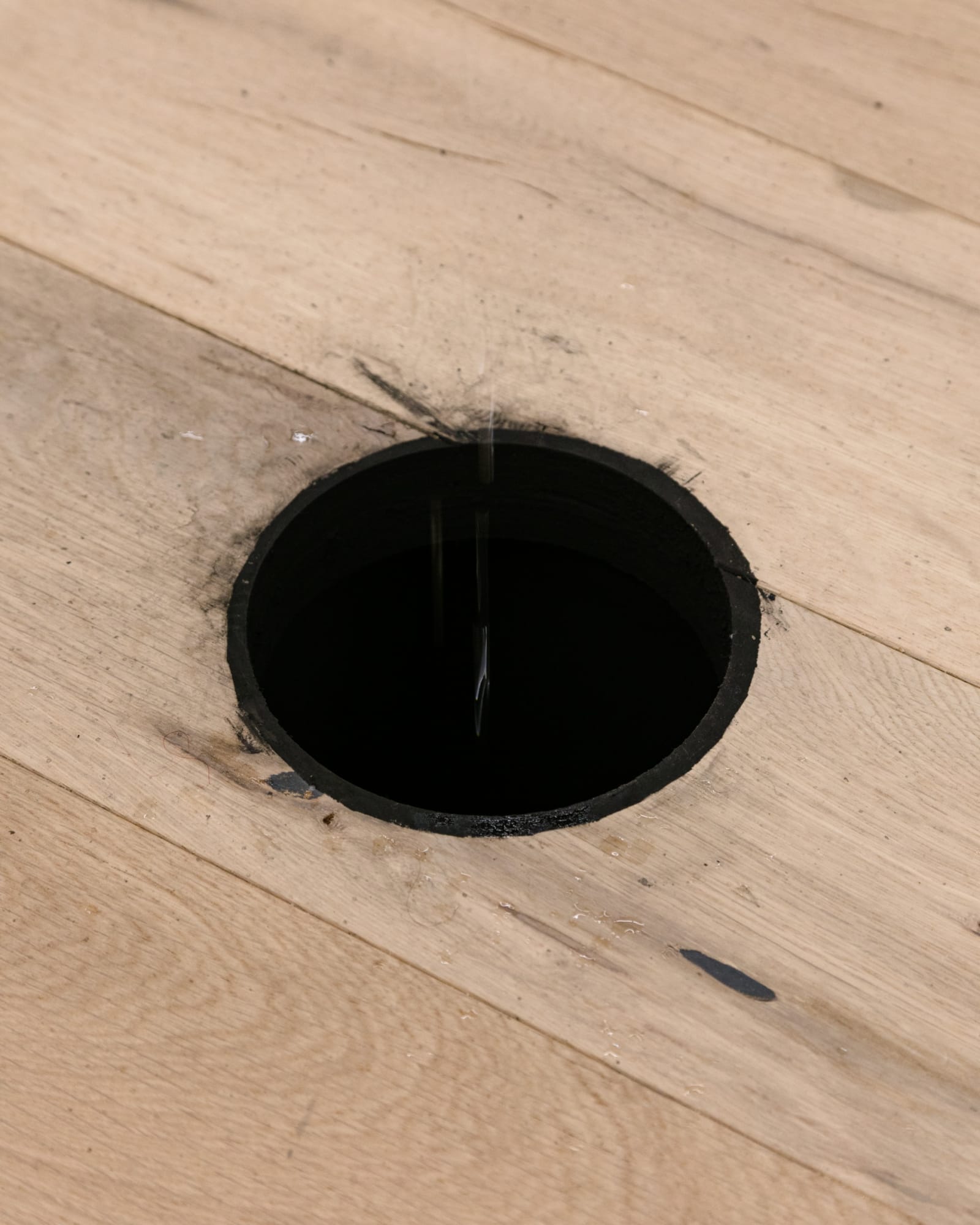 Pope.L Pedestal, 2017 acrylic paint, drain, Elkay drinking fountain #EFA201F, hardware, hole, photo timer, plastic pail, plastic sheeting, solenoid, tape, tubing, and wood Dimensions variable