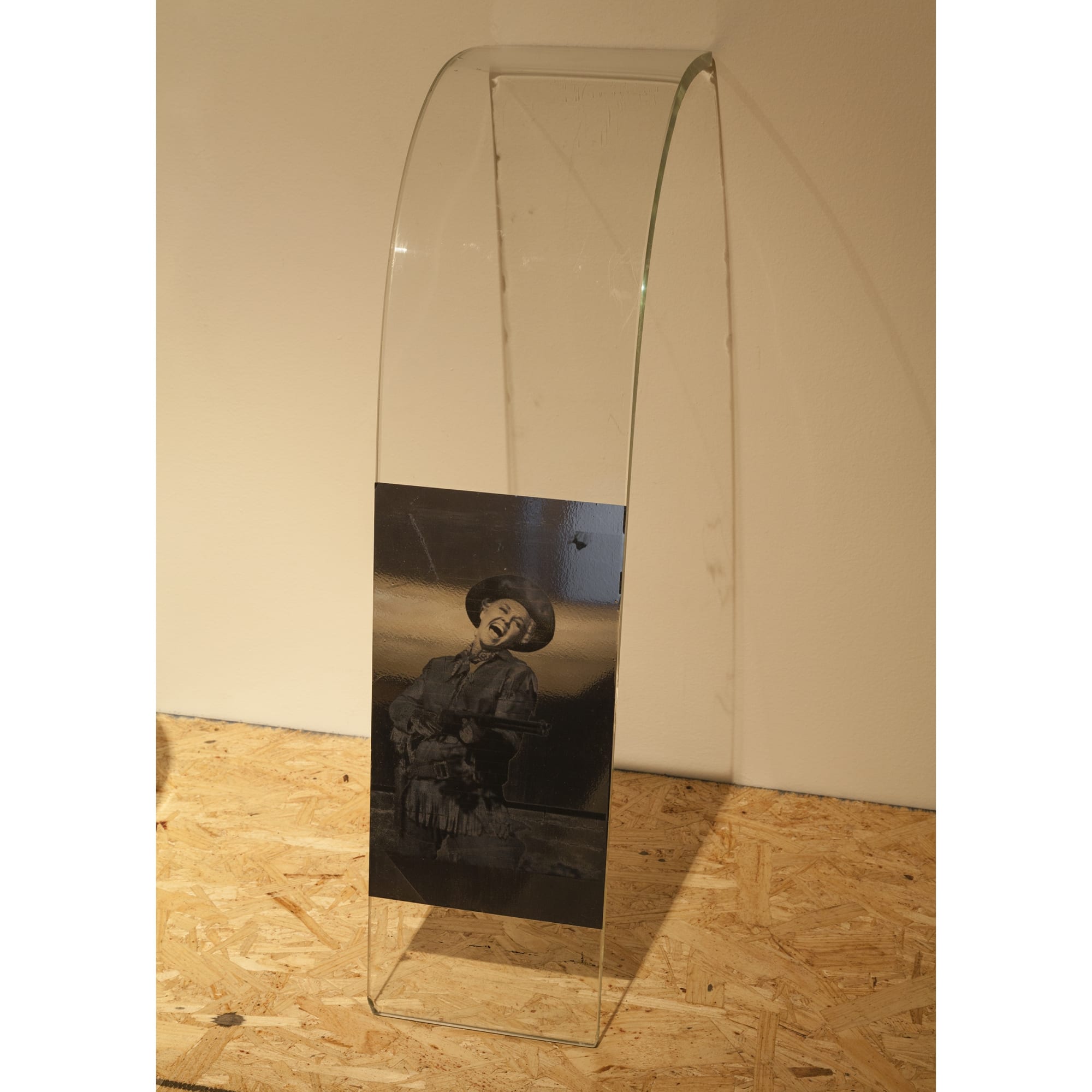 Servane Mary Untitled (Cowgirl with a gun), 2015 inkjet print on silver adhesive mylar, glass 7 x 27 1/2 x 11 inches