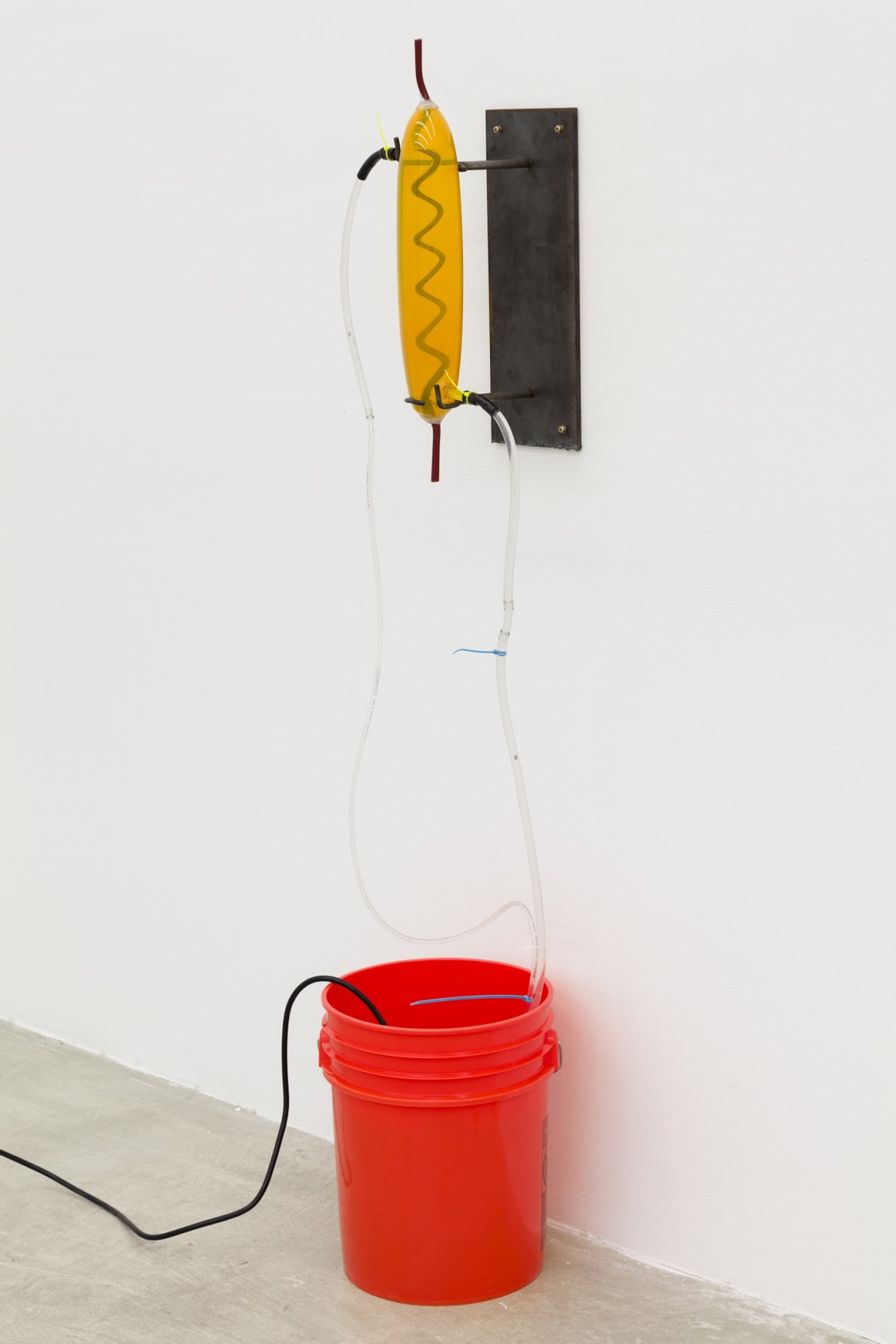 Elias Hansen Could’ve been worse, 2012 bucket, glass, silicone, steel, vinyl, water, water pump Dimensions variable