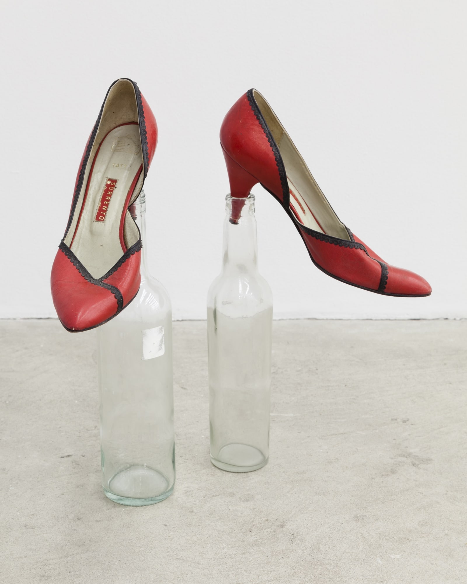 Climent Martin Soto Poking Shoes, 2007 women’s shoes, two glass bottles Dimensions variable