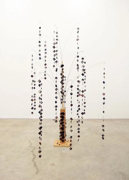 B. Wurtz Collection #5, 1999 wood, metal, 35 mm transperencies, buttons, thread 94 x 50 x 50 in