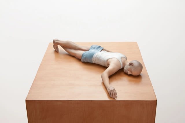 ERIC WESLEY New Realistic Figures (Sleeping): Michel, 2009/2015 Paint and plastic on stained maple pedestal Figure: 3 1/2 x 8 3/4 x 18 in (8.9 x 22.2 x 45.7cm) Pedestal: 56 x 11 1/2 x 11 1/2 in (142.2 x 29.2 x 29.2cm)