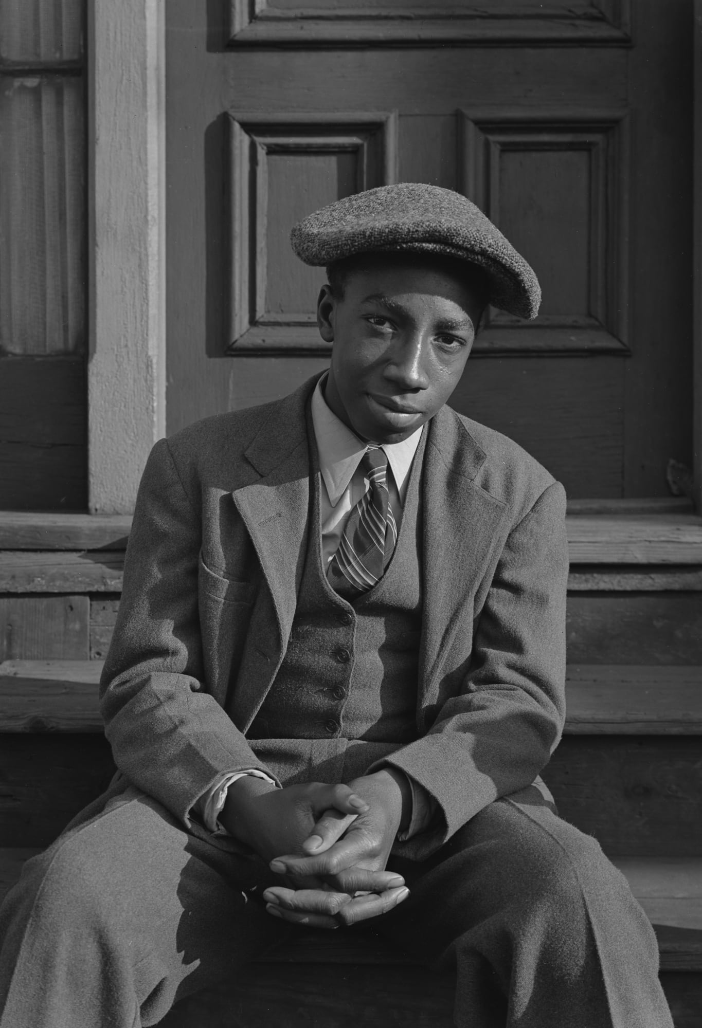 Boy on Steps with Cap, Detroit, 1942
