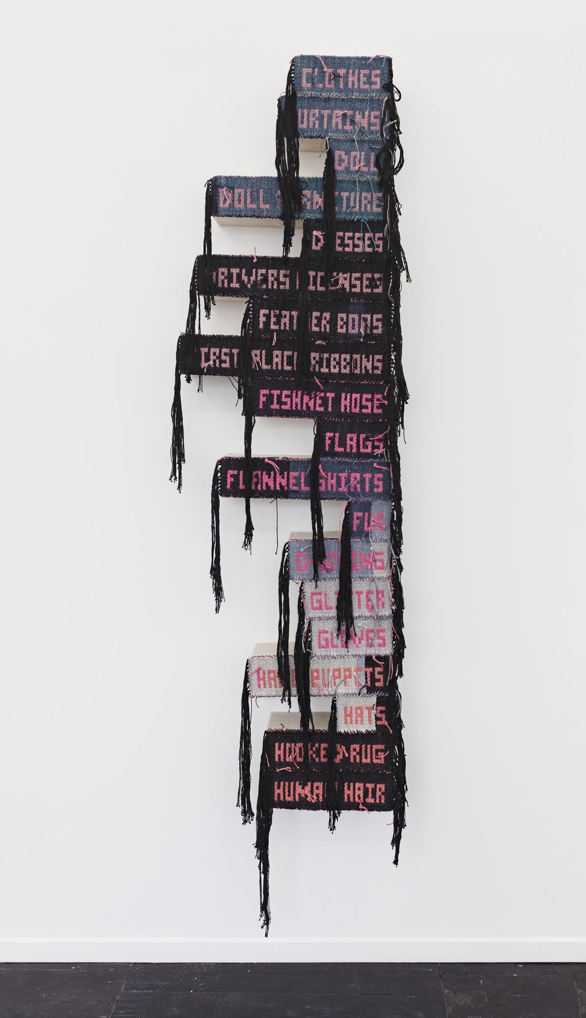 Josh Faught Bereaved on a Budget, 2022 Hand dyed, bleached, and woven hemp; woven list of materials used in the NAMES Project AIDS Memorial Quilt on stretched linen 185 x 54 x 12 cm 72 7/8 x 21 1/4 x 4 3/4 in