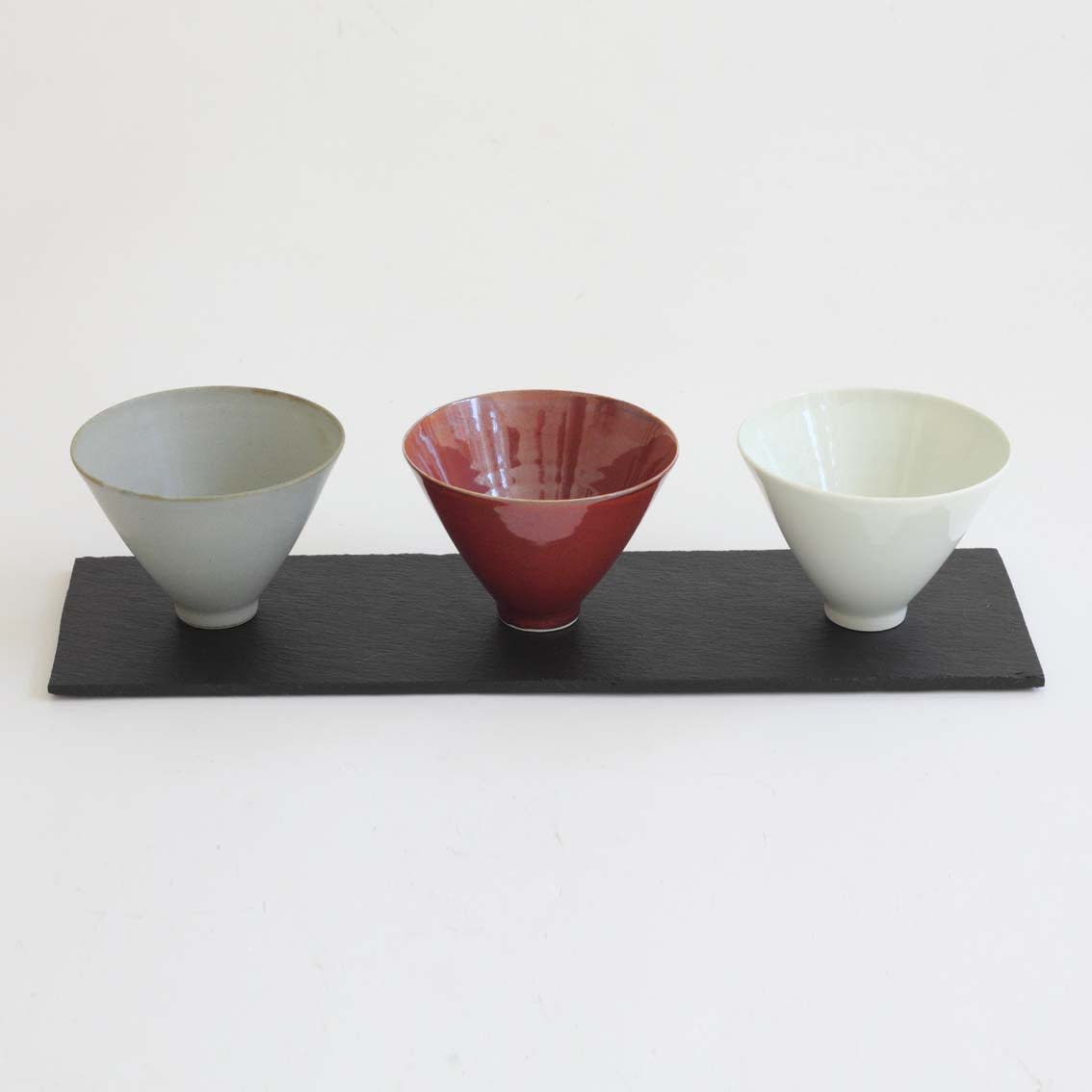 Robyn Hardyman, RH21 set of 3 dishes on slate, celadon/red/blue-grey