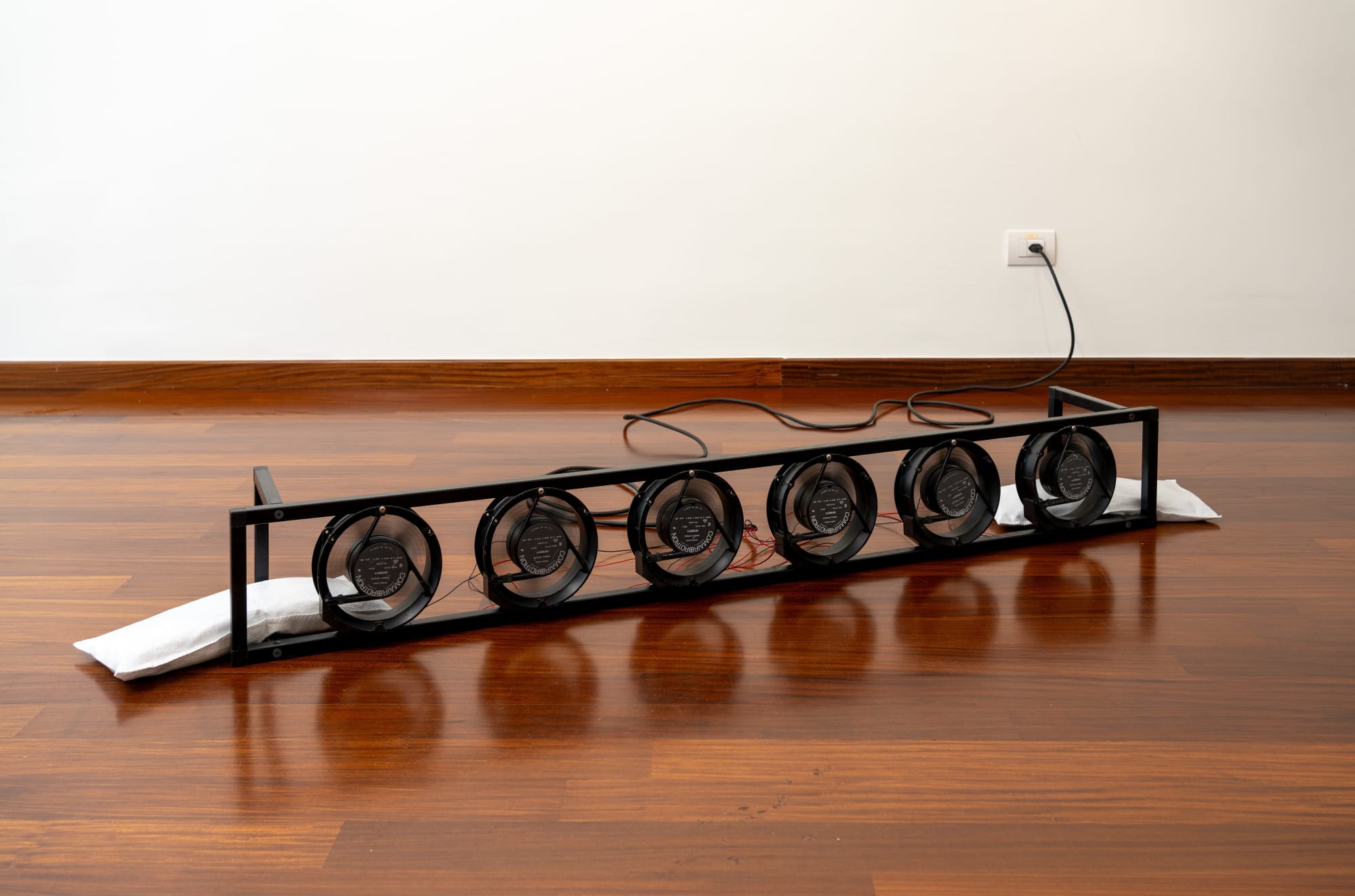 Byron Gago, Acid Arcs - Heilt, 2025 Metal hollow bars, 6 Comair Rotron PT77B3, electronic components, cables, wires, 21 x 23 x 154 cm