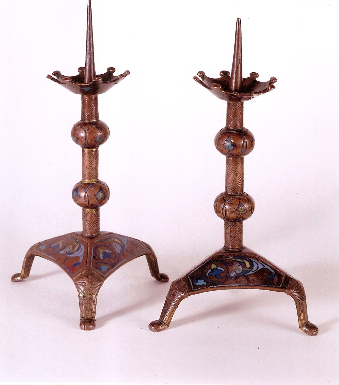 Pair of candlesticks, French, Limoges, c.1160-70, champlevé enamel on gilded copper; h. 24.5 cm and 25.2 cm