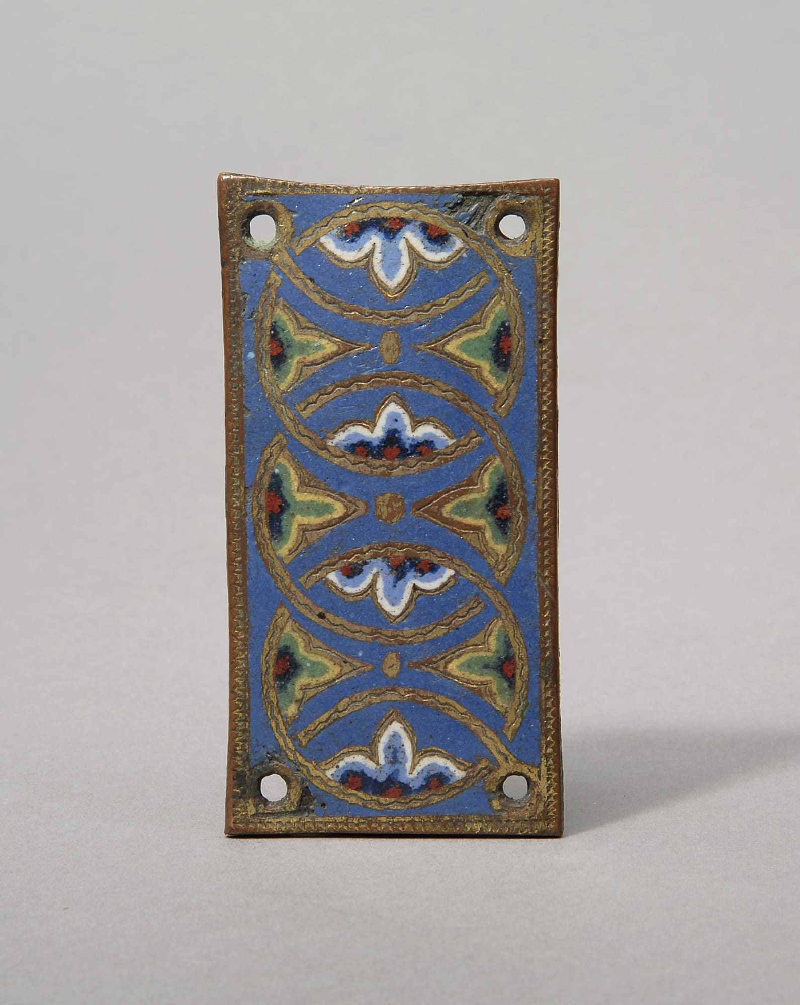 Plaque with foliate designs from the Orense altar frontal or retable (3 of 3), French, Limoges, c.1188, champlevé enamel on gilded copper; h. 4.7 cm x w. 9.3 cm