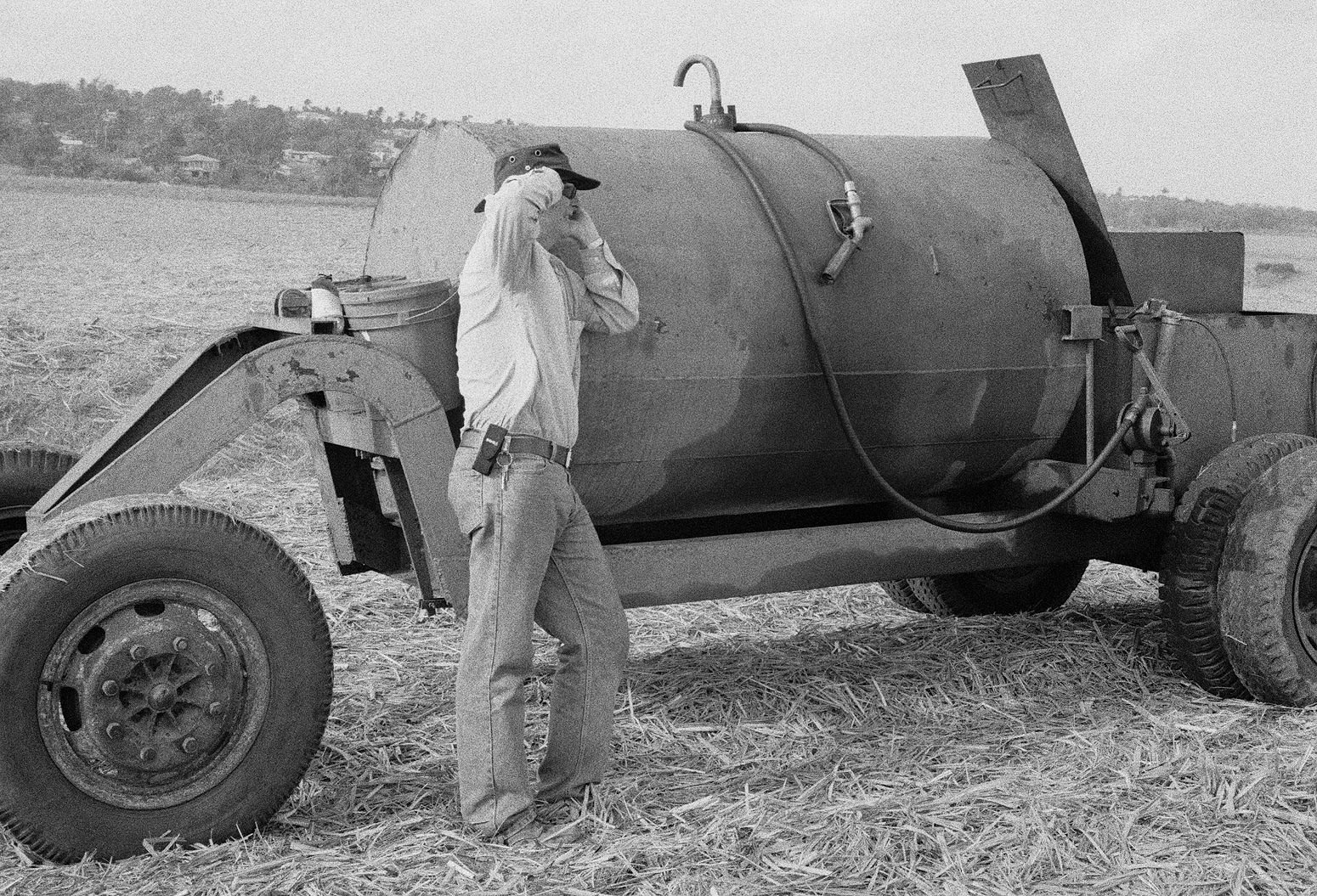 Michael on the Phone, Brighton Farm, St. George, Barbados, 2010 Selenium Toned Silver Gelatin Print, 16x20" Archival Pigment Print on Moab Entrada Rag, 17x21" Edition of Three