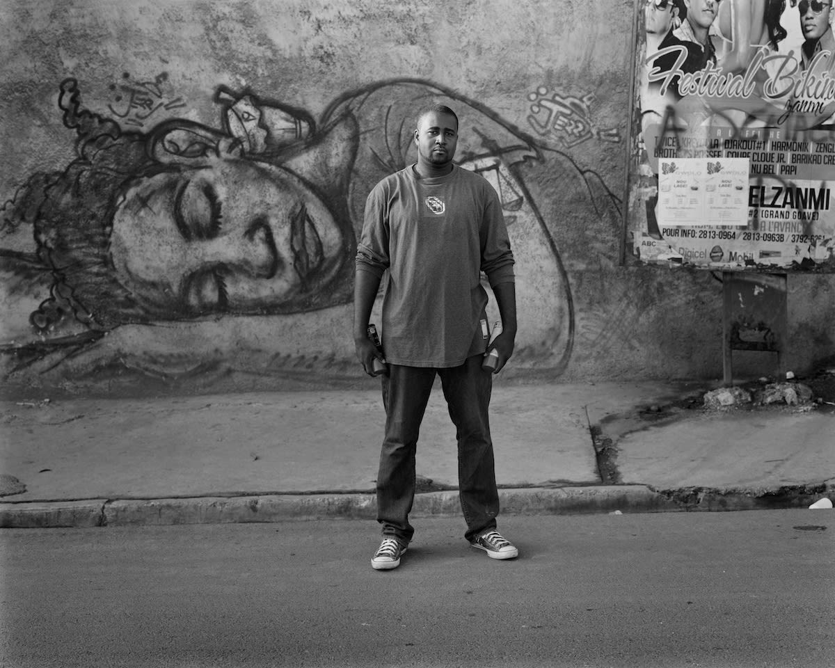 Jerry Rosembert With His Work, Petionville, March 2014 pigmented inkjet print on paper