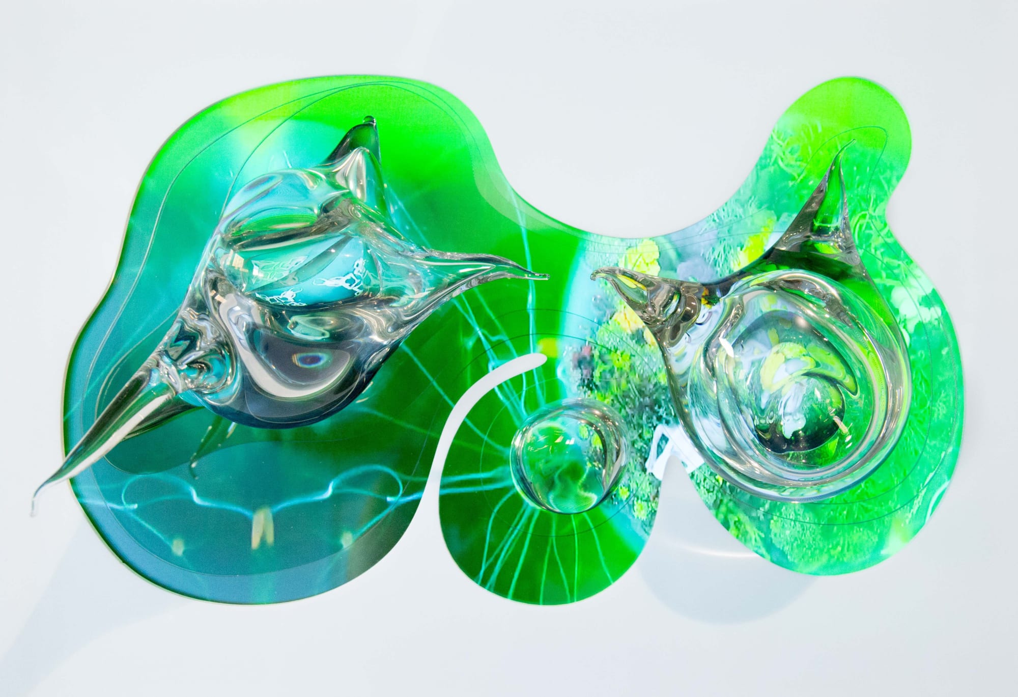 There is a dying dancing tribe, 2018 Multi-channel video, 11:11 minutes, looped Hand-blown glass sculptures, video screen embedded in white acrylic