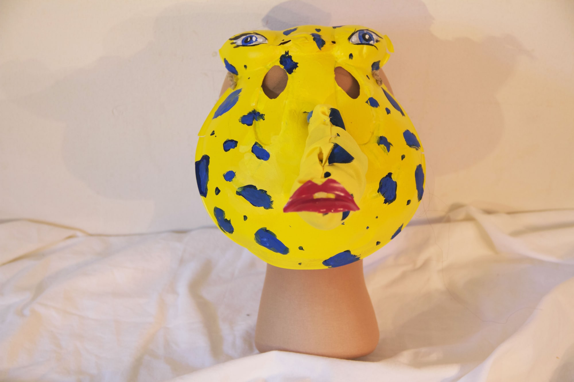 Sy, 2016 - 2018 Plastic masks, nylon, acrylic paint, synthetic wigs, hairspray, styrofoam, hot glue, eyelashes