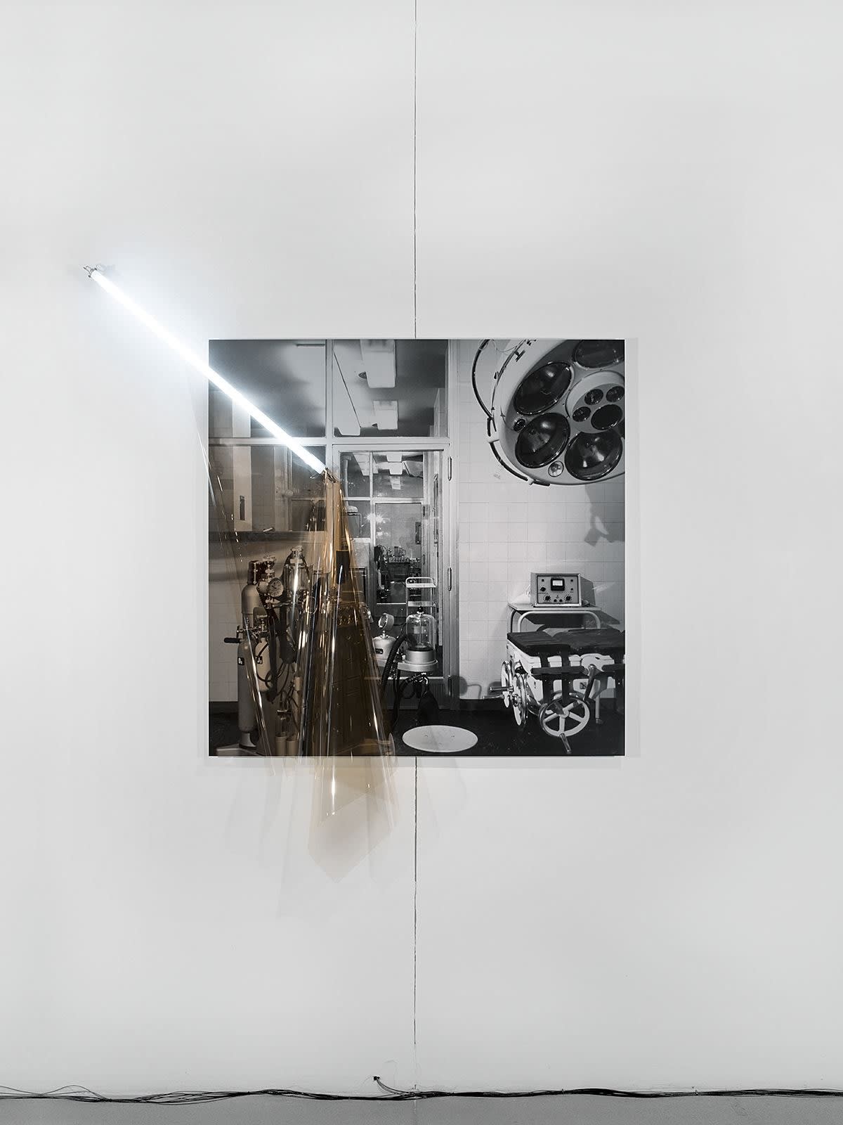 Untitled (Archive ST3: Military Hospital), 2017 Inkjet print on archival paper mounted on aluminum composite panel, colour correction filter, fluorescent light tube, electrical fittings / archival photograph