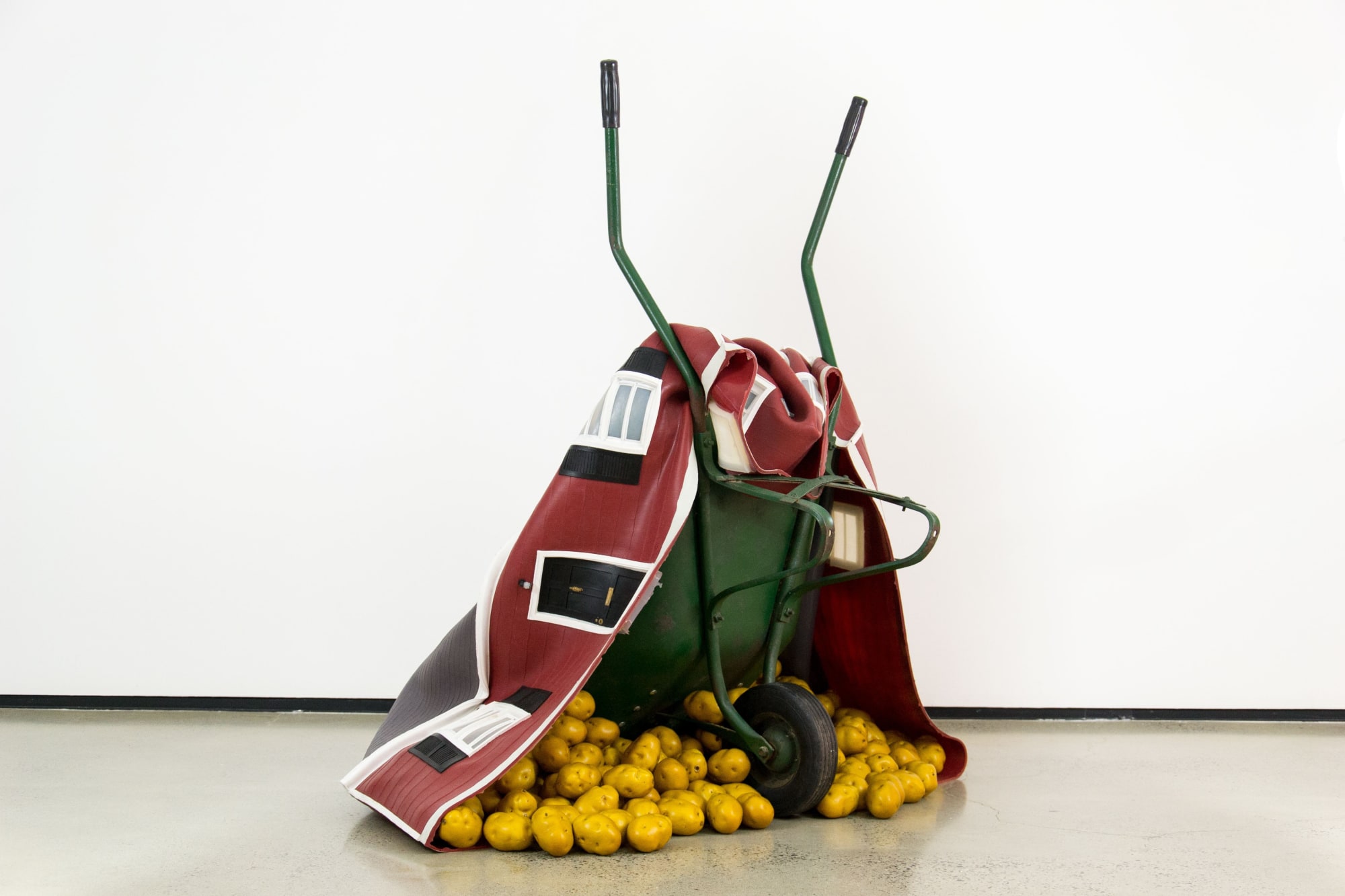 Phytophthora Investments, 2009 Wheelbarrow, plastic potatoes, platinum silicon rubber