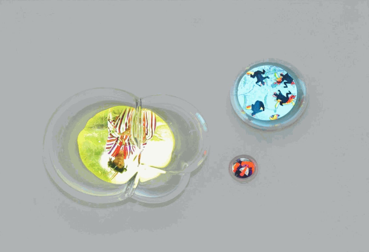 DO YOU HEAR THE CALL FOR THE CREATURES' UNDERWORLD?, 2016 Single-channel video, 4:20 minutes, looped hand-blown glass bubble, video screen embedded in white acrylic