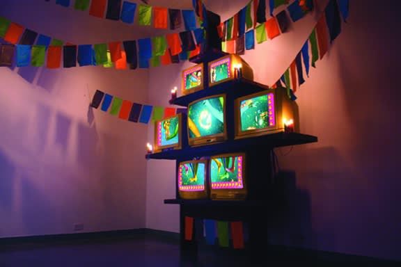 Open Arms, 2011 7 channel video installation, wood, wax, fabric, lemons, CRT TVs, DVD players, cabinet with variable fabric peripherals