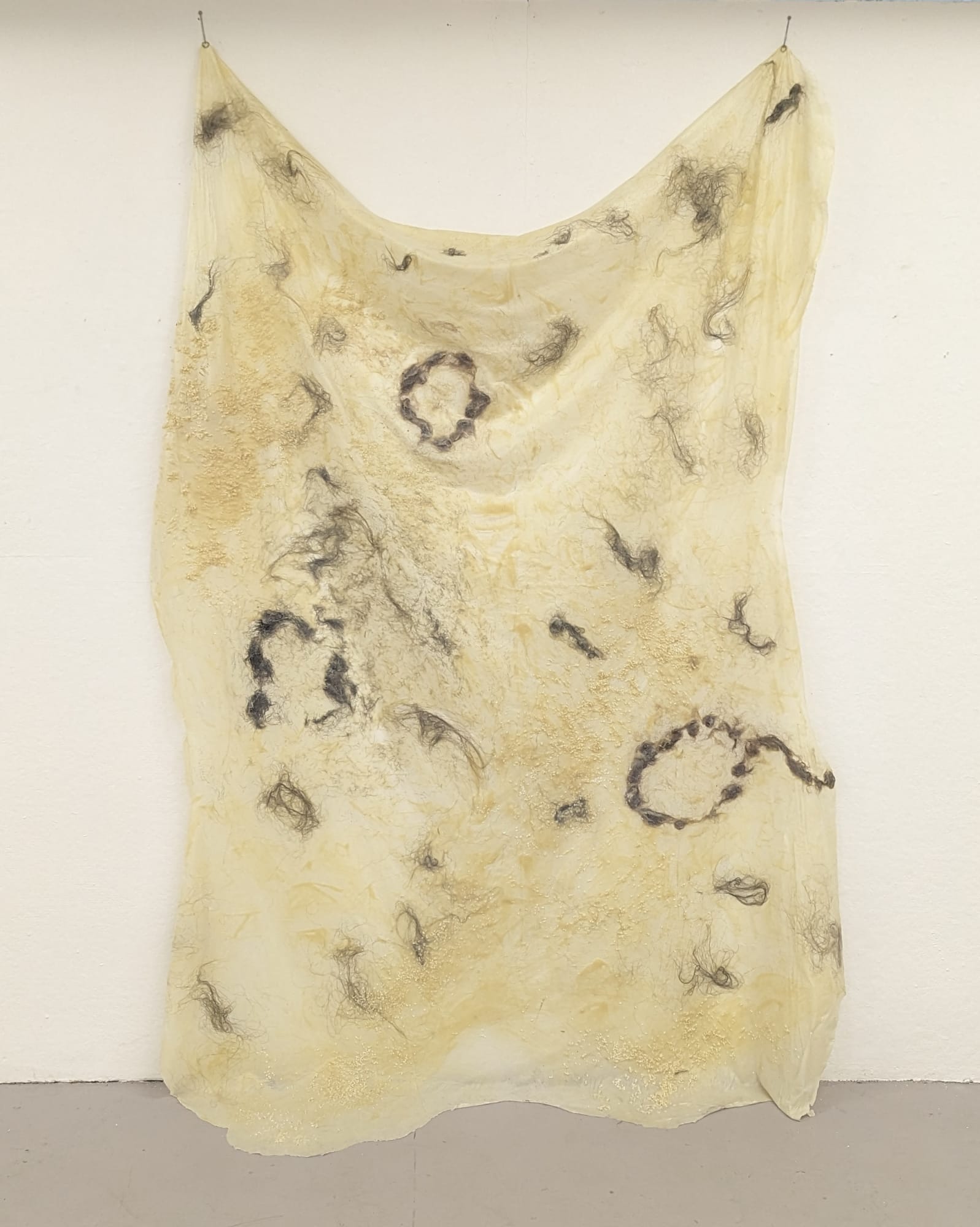 River Kim Spiraling Inward, 2023 Latex, hair, fishing hooks 106h x 56w in