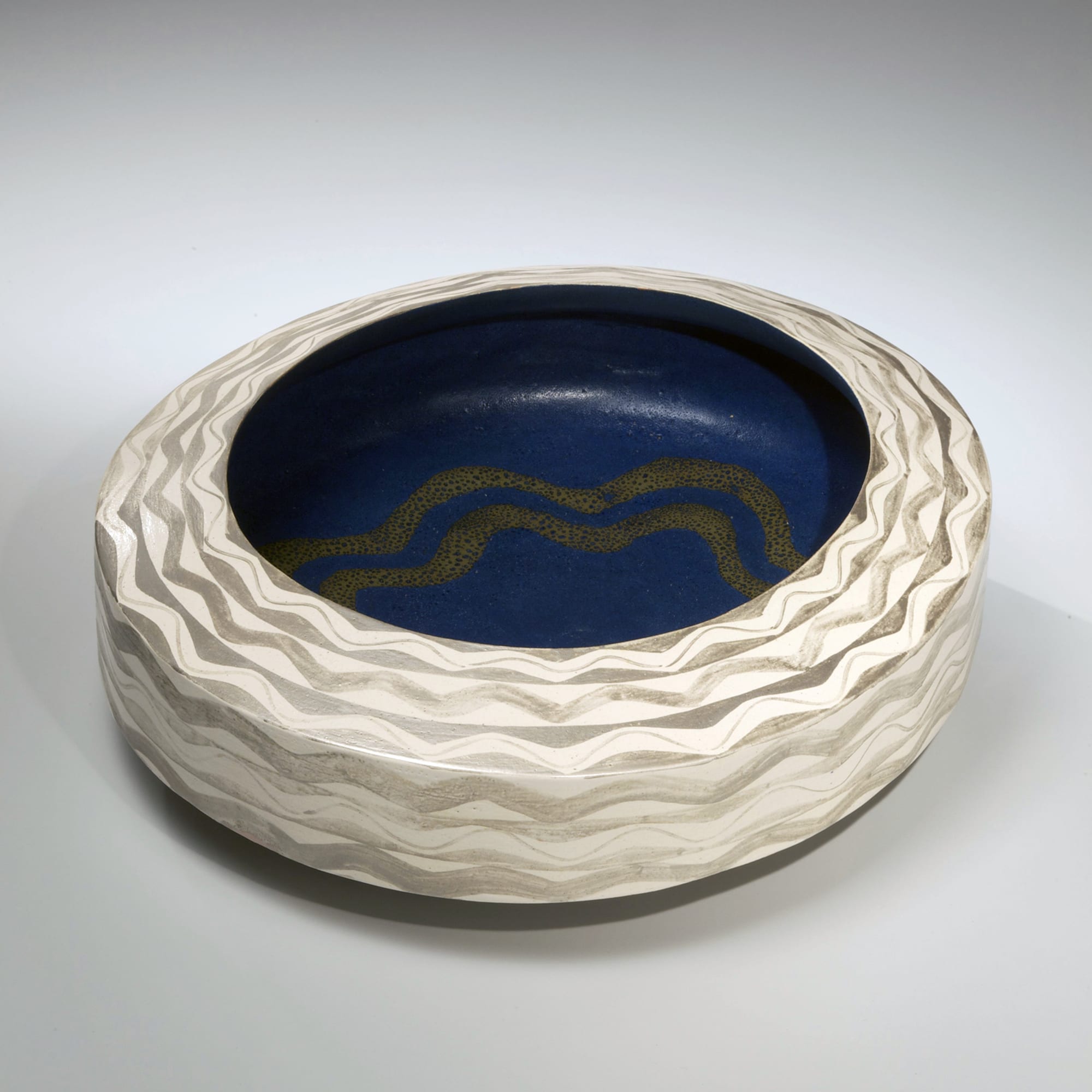 Low, ovoid bowl with wave-patterned silver glaze and white, blue and gold glazed interior 1982 Glazed stoneware 4 1/2 x 12 5/8 x 14 in. Inv# 7174
