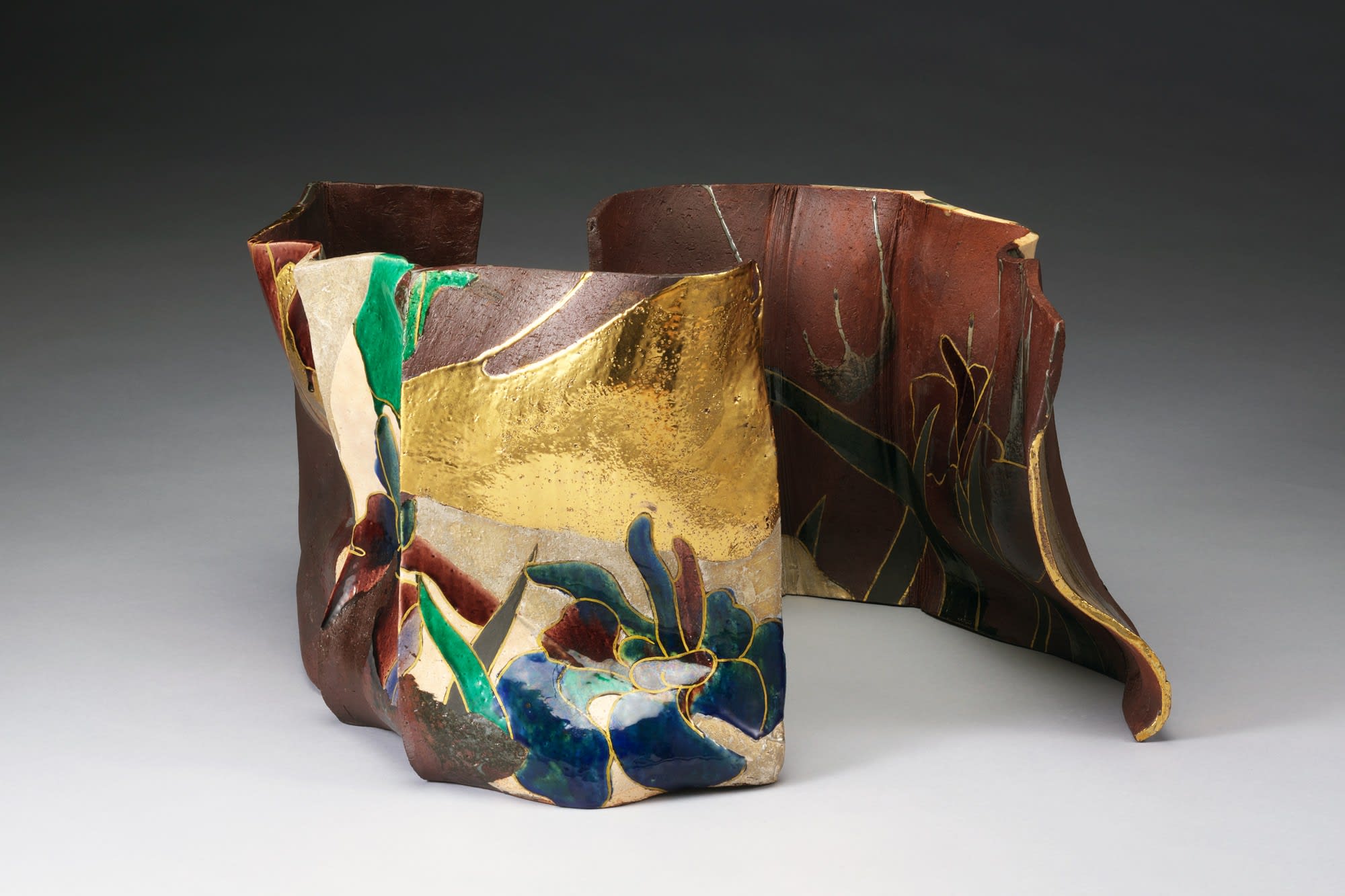Vessel that is not a Vessel in screen-like form decorated with irises 2016 Stoneware with polychrome under and over glazes a. 10 5/8 x 16 1/8 x 7 1/2 in.; b. 10 1/4 x 13 3/8 x 7 7/8 in. Inv # 10116 SOLD