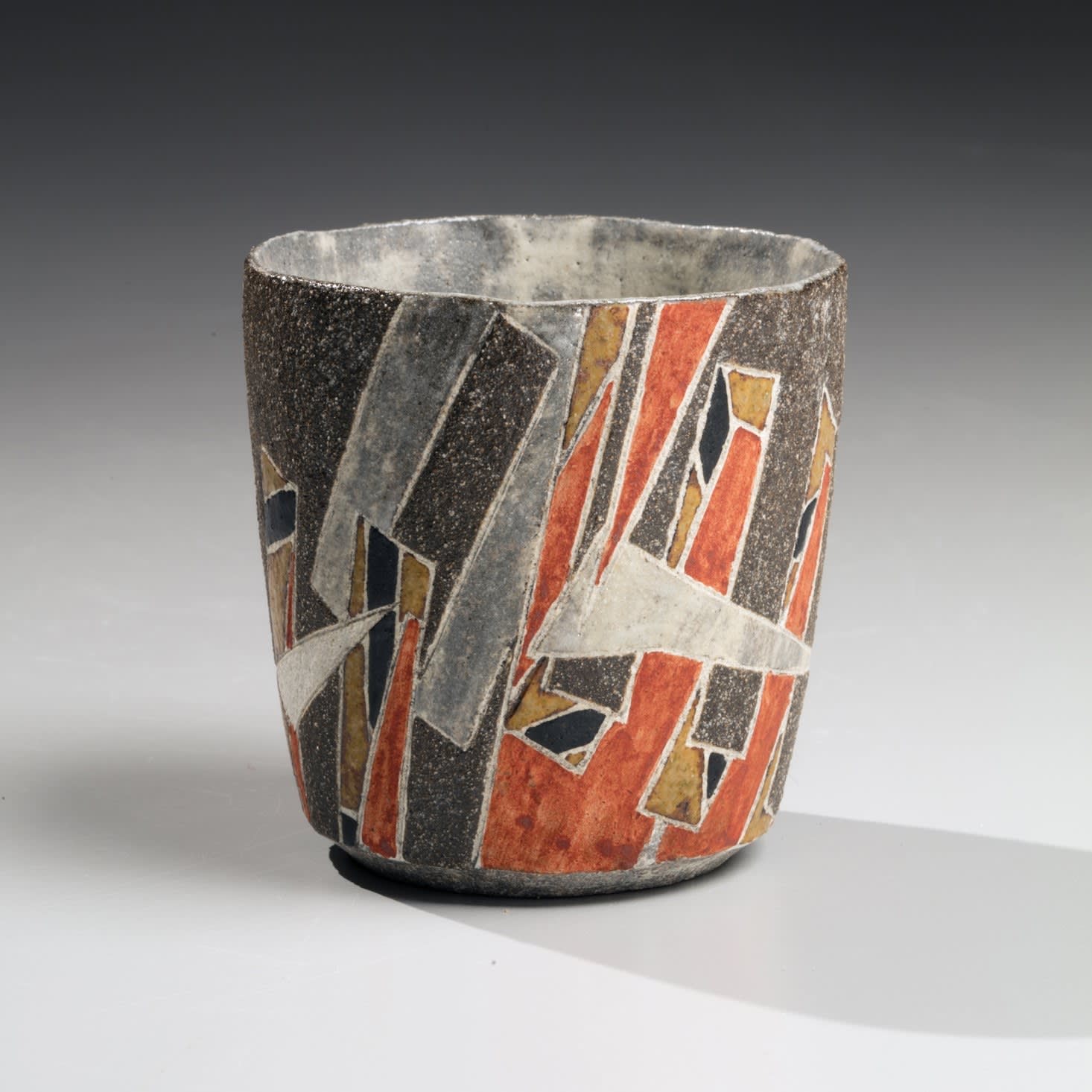 Wada Morihiro Kifūmon shuhai "Fluttering Banners-patterned Sake Cup" ca. 2006 Slip-glazed stoneware 3 1/4 x 3 x 2 1/4 in. Inv# 10629 SOLD