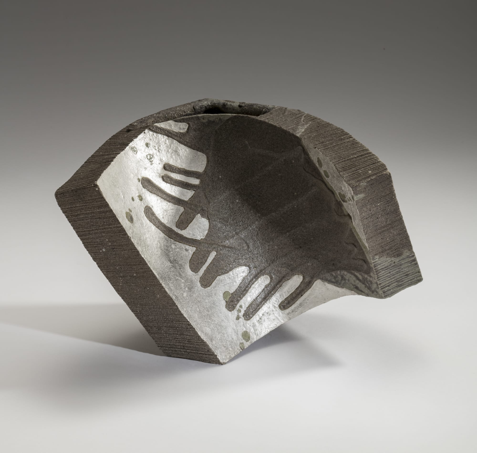 Hoshino Kayoko (b. 1949) Cut Out - Fan 17 -11 2017 Stoneware with ash glaze and silver 11 3/4 x 18 1/4 x 10 7/8 inches Inv# 10643 SOLD
