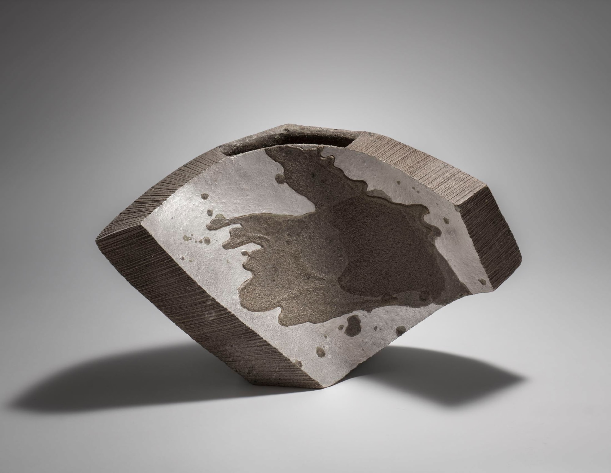 Hoshino Kayoko (b. 1949) Cut Out Fan - 18-3 2018 Stoneware with ash and silver glazes 11 7/8 x 18 1/2 x 7 7/8 inches Inv# 10644 SOLD