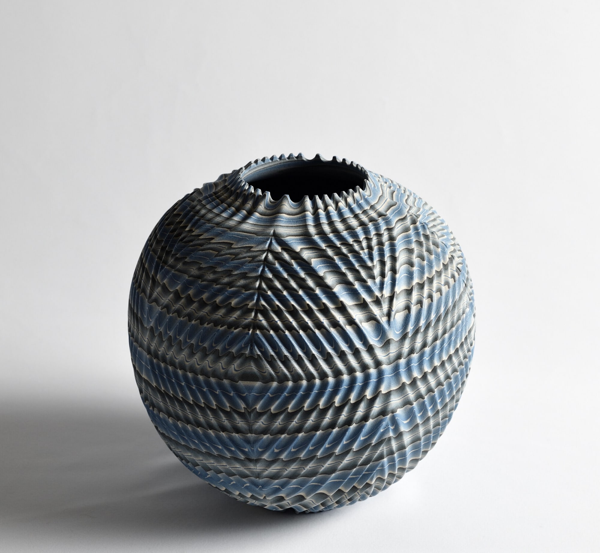 Ogata Kamio (b. 1949) Neriage (marbleized) vessel with carved, ridged surface, short spiked mouth and concentric triangular carving titled &ldquo;Waves&rdquo; 2019 Marbleized stoneware with transparent matte glaze 7 3/4 x 7 7/8 x 7 7/8 in. Inv# 11063 SOLD